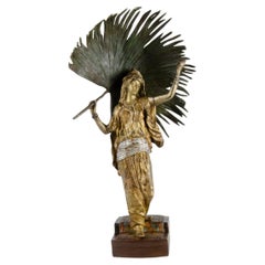 Bemalte Bronzeskulptur einer Frau, die ein Blatt Palmenblatt hält, von Franz Bergmann, Österreich