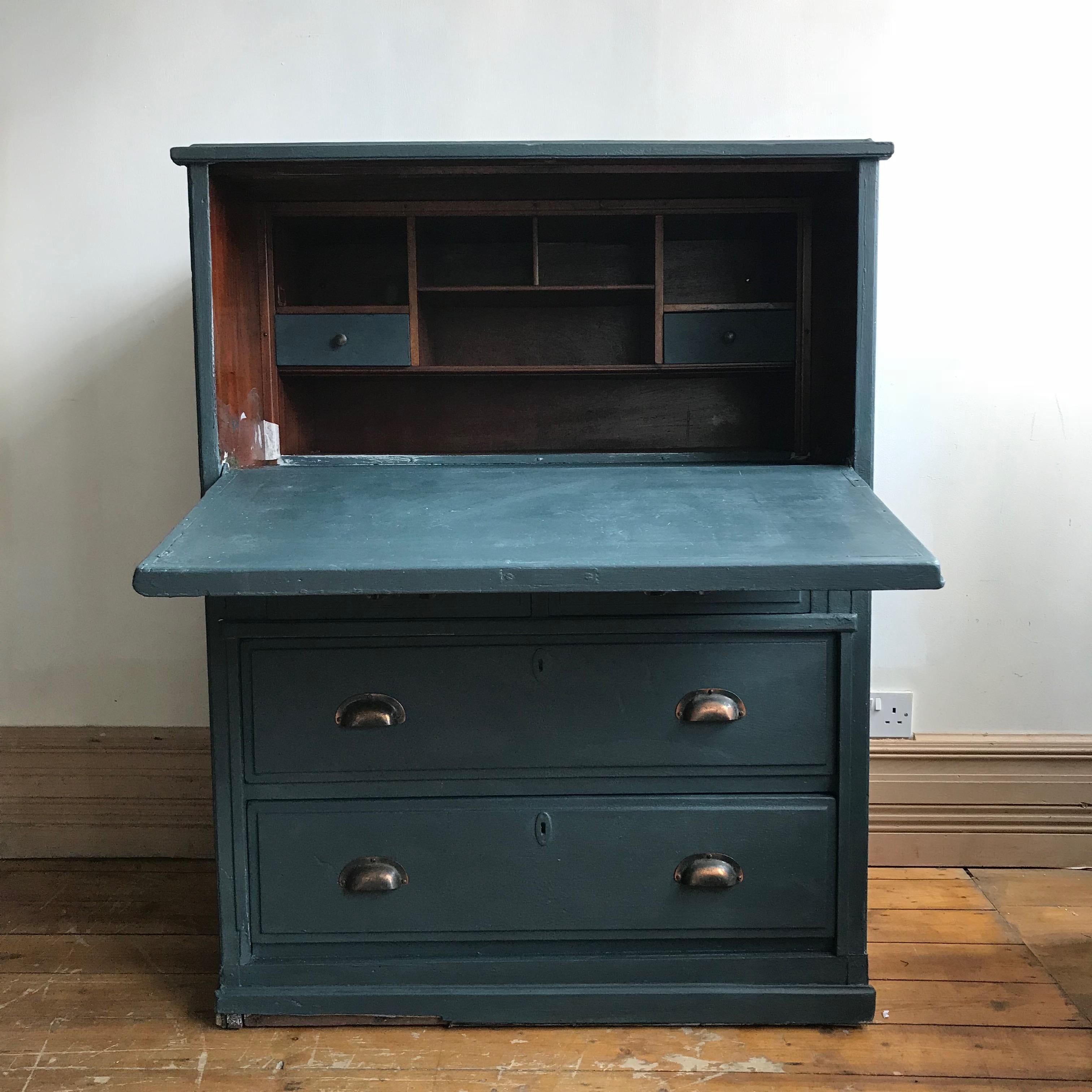 Painted cupboard with bureau style drop down front and four drawers all with their original tarnish d-cup handles.