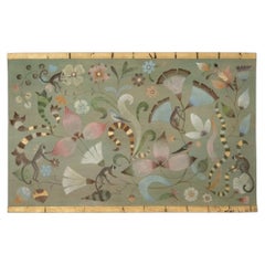Painted canvas decorated with lemurs, birds, and flowers. Contemporary.