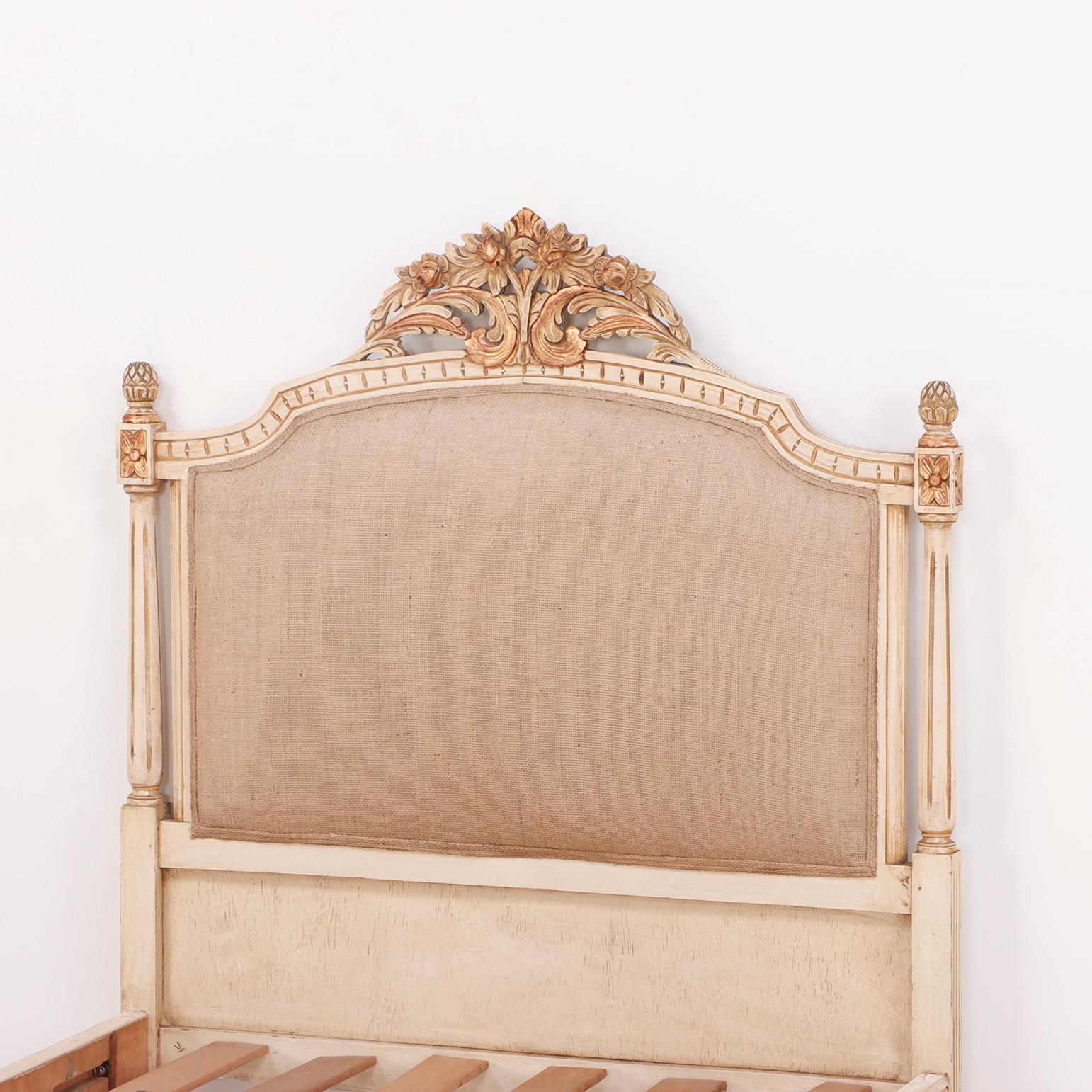 Painted, carved and gilt Louis XVI style twin size beds C 1950. Both the head and the footboards having carved crests. Interior Dimensions: 36.5