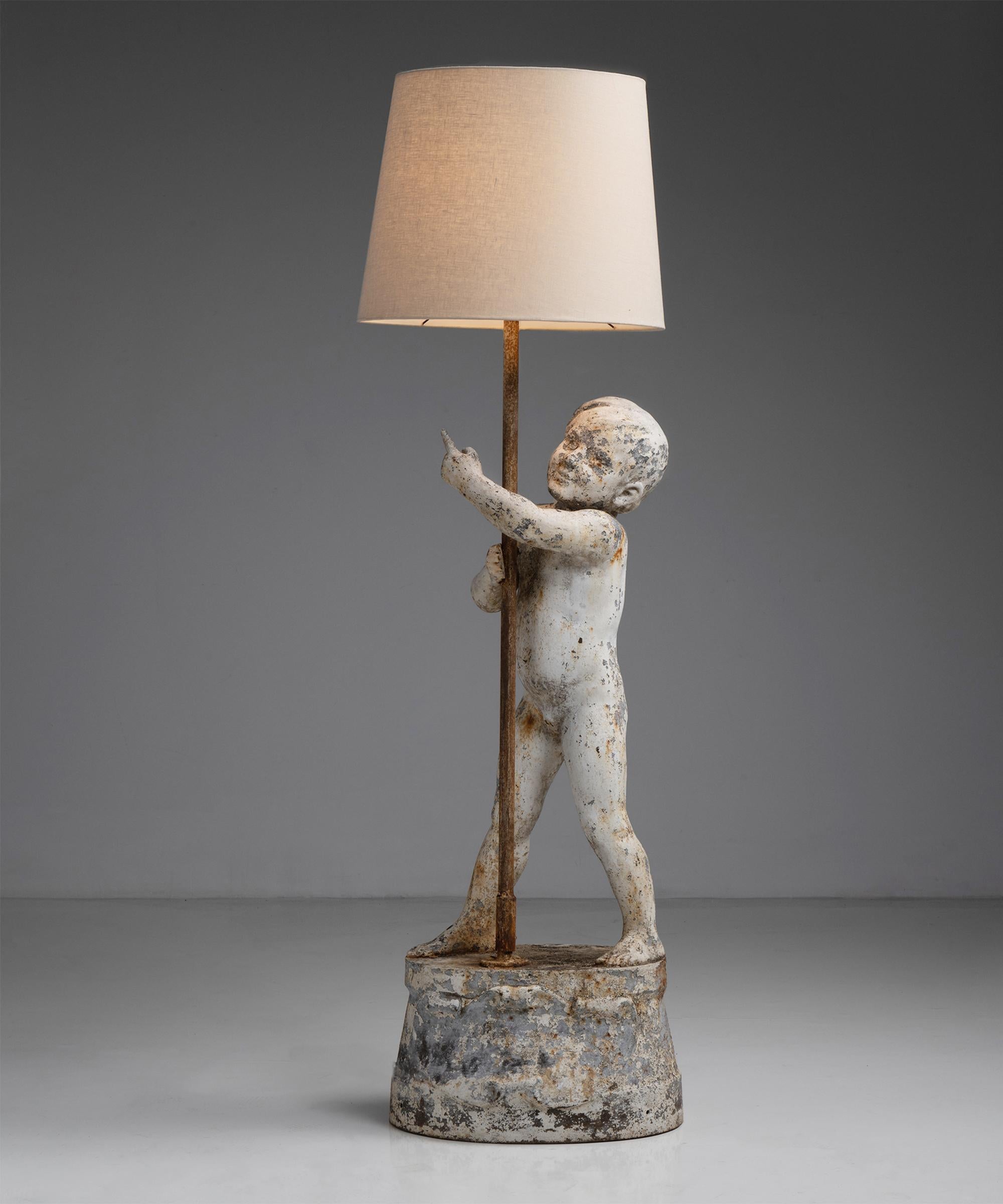 Painted Cast Iron Cherubic Floor Lamp, England circa 1900

Cast iron floor lamp with a standing cherubic boy on raised circular base.