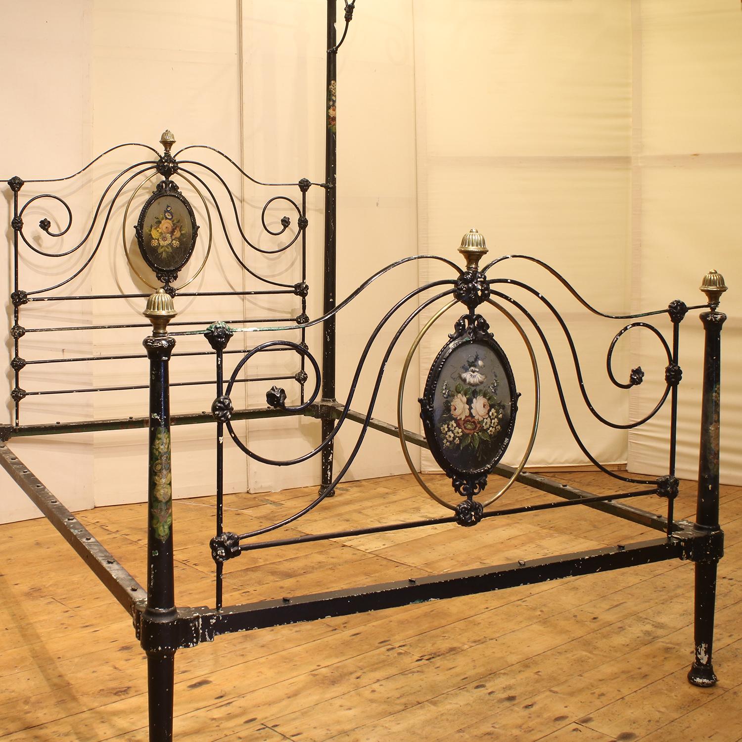 This superb original mid-Victorian cast iron half tester bed has the original floral painted central plaques and posts. The tall tapered posts on the back of the bed support an unusual 'hook' canopy, which would have supported drapes.
The black