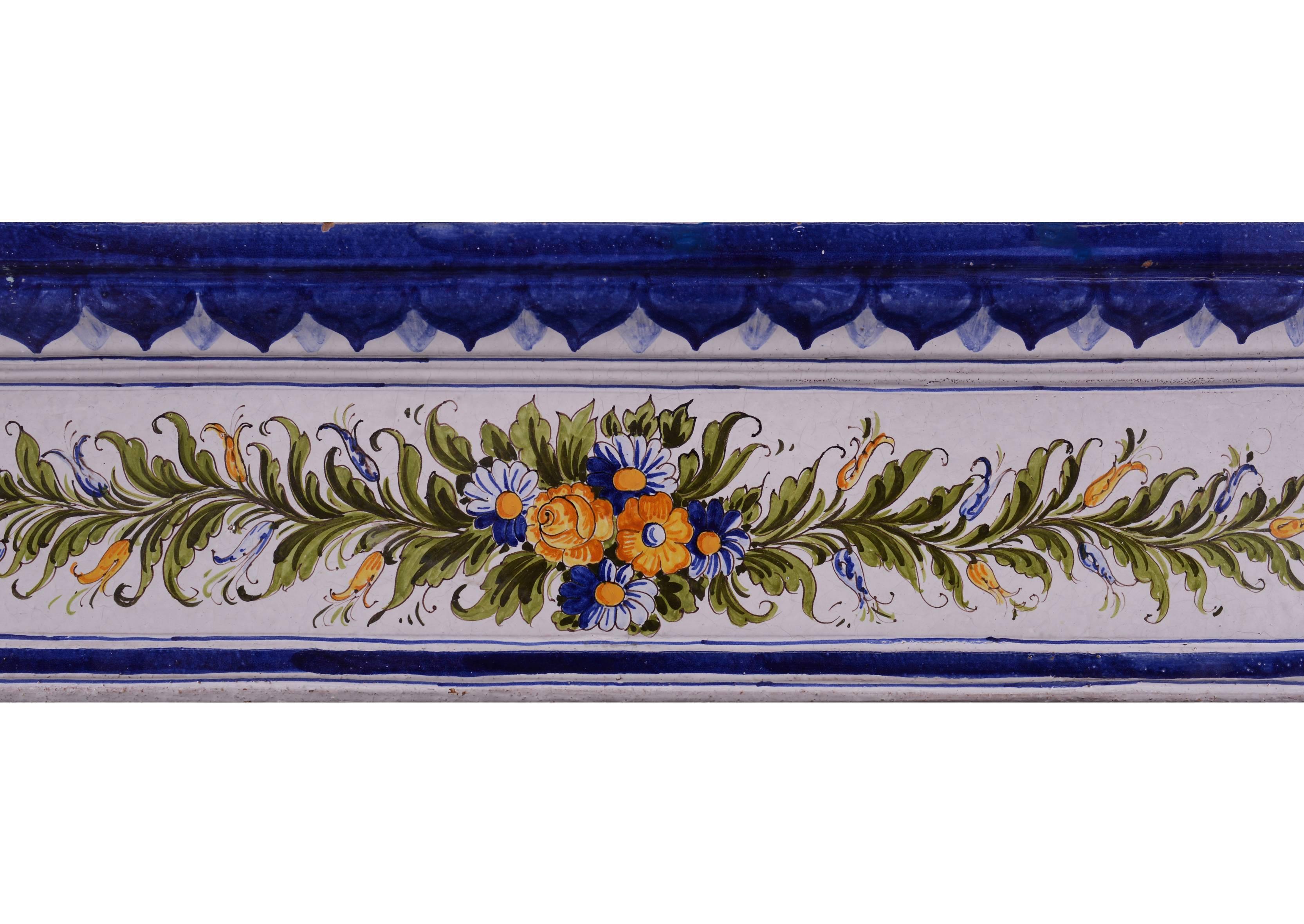 A delicate ceramic fireplace. The hand-painted legs and frieze featuring flowers and foliage throughout, with royal blue edging and shelf. An unusual piece well suited for a bedroom, kitchen or smaller morning room, circa 1900.


Shelf width 1067