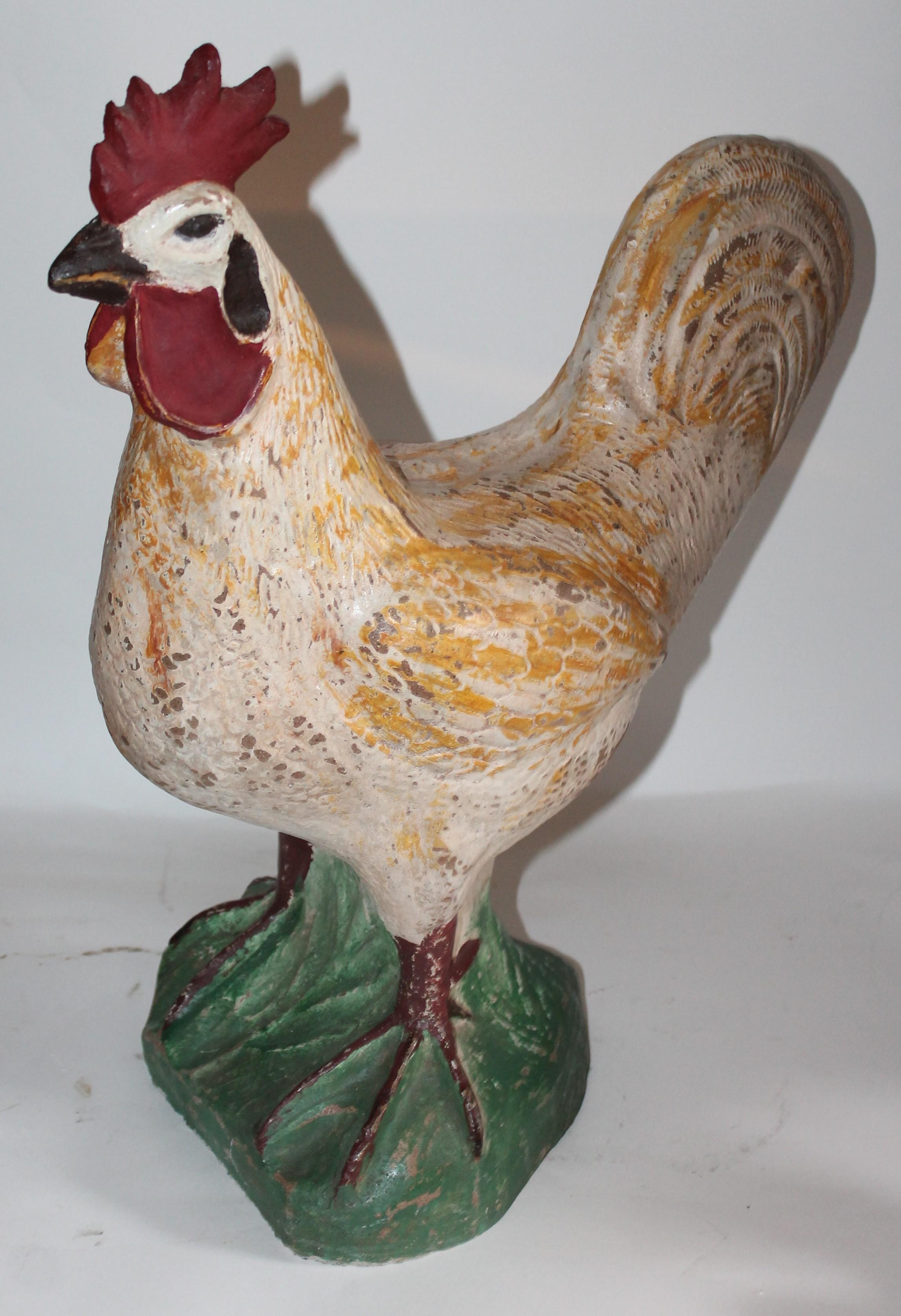 This painted concrete rooster is in great condition as found with colorful painted surface. Was found on a farm in the mid-west.