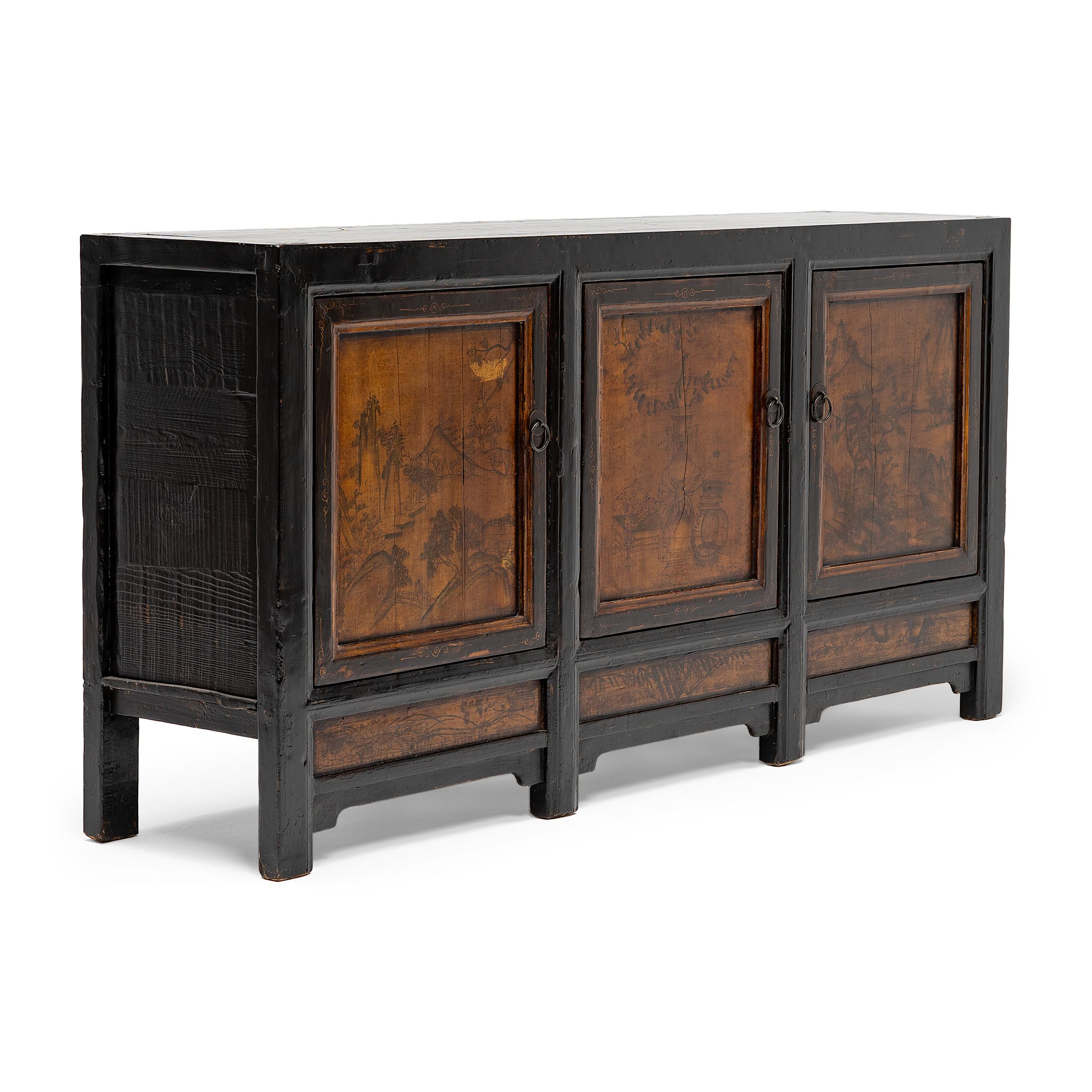 This provincial coffer from northern China has a simple, clean-lined form embellished with black lacquer and hand-painted inset panels. The cabinet was crafted in the mid-19th century with mortise-and-tenon joinery methods, without the use of nails