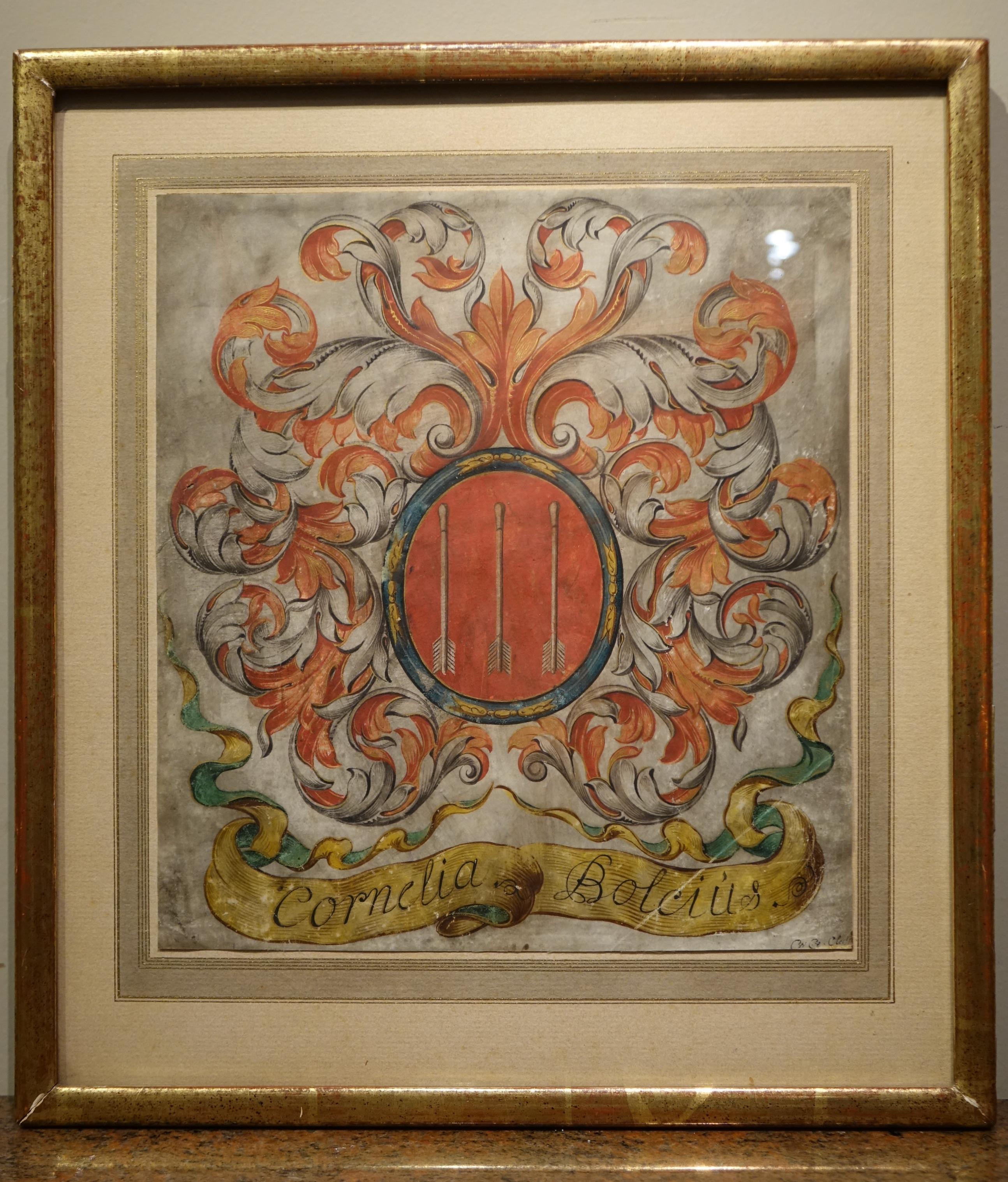 Interessantes Wappen in Blasonierung, umgeben von Blattwerk, mit einer Art Phylakterie, auf der der Name von Cornelia BOLSIUS vermerkt ist. 
In der Mitte befinden sich drei geschützte Armbrustbolzen (oder Pfeile). 
Vellum oder Pergament, Flandern,