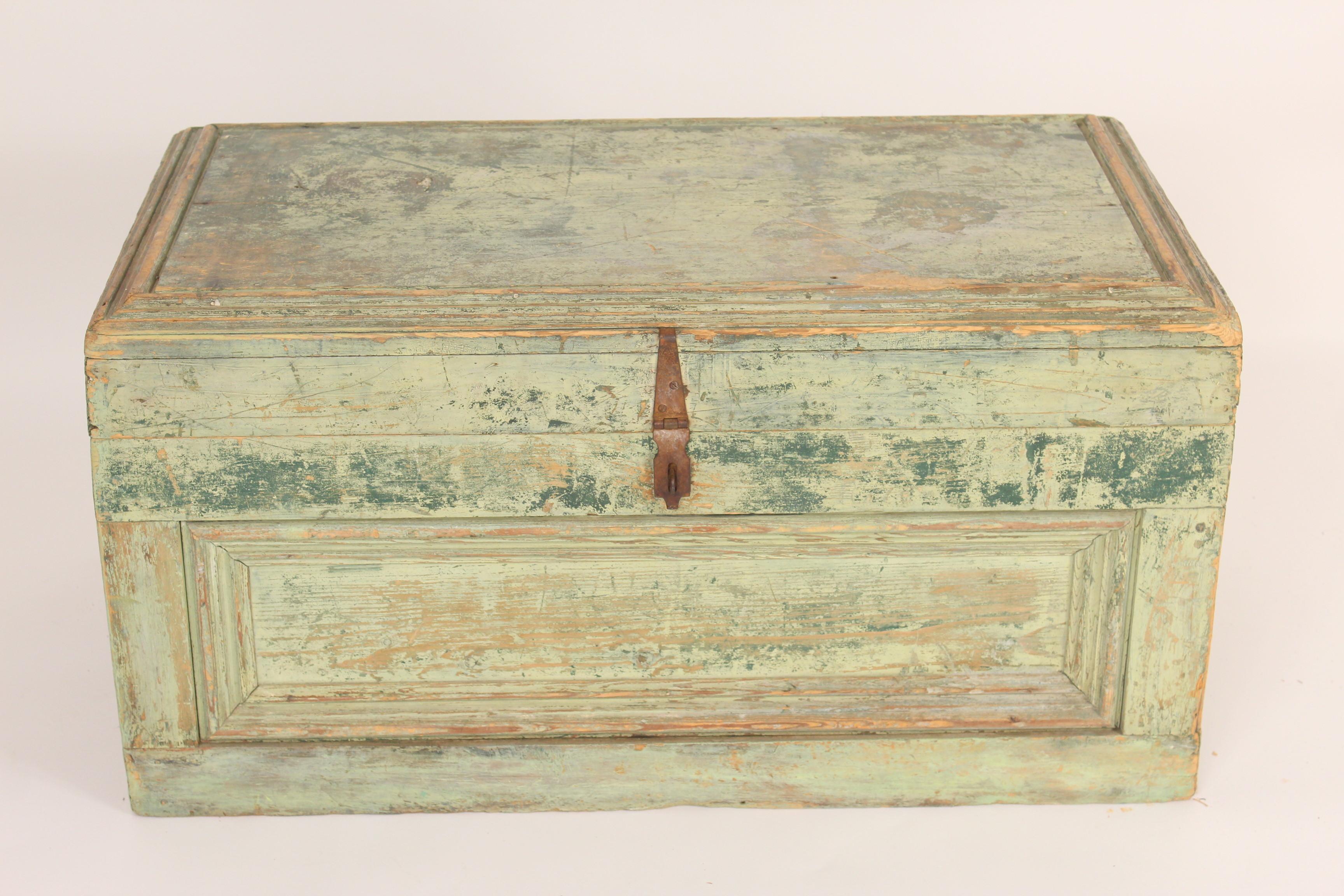 Trunk with old paint and iron hardware, late 19th century. Great for a coffee table or at the foot of a bed.