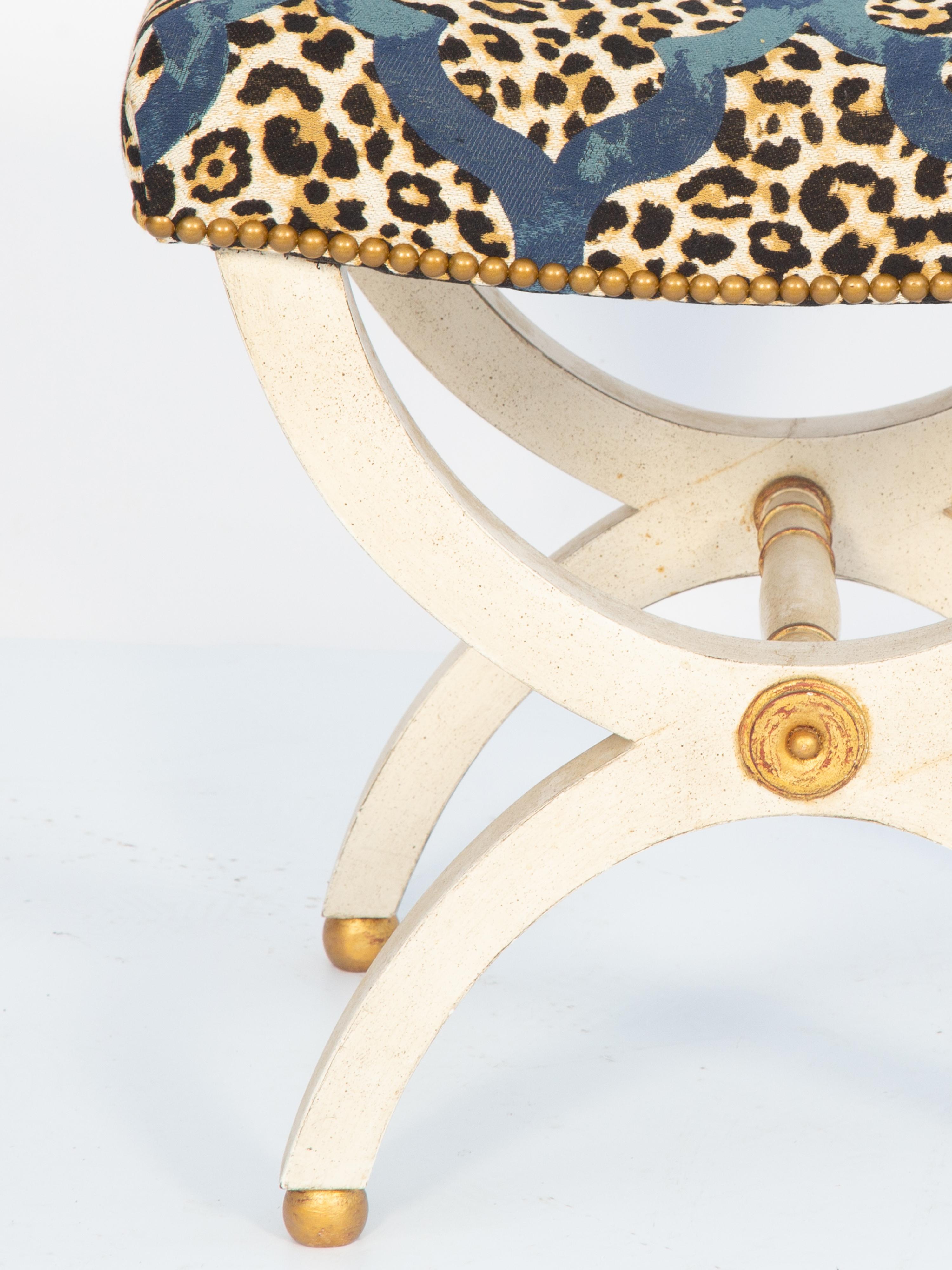 20th Century Painted Curule Bench with Gilt Accents Upholstered with Leopard Print Fabric