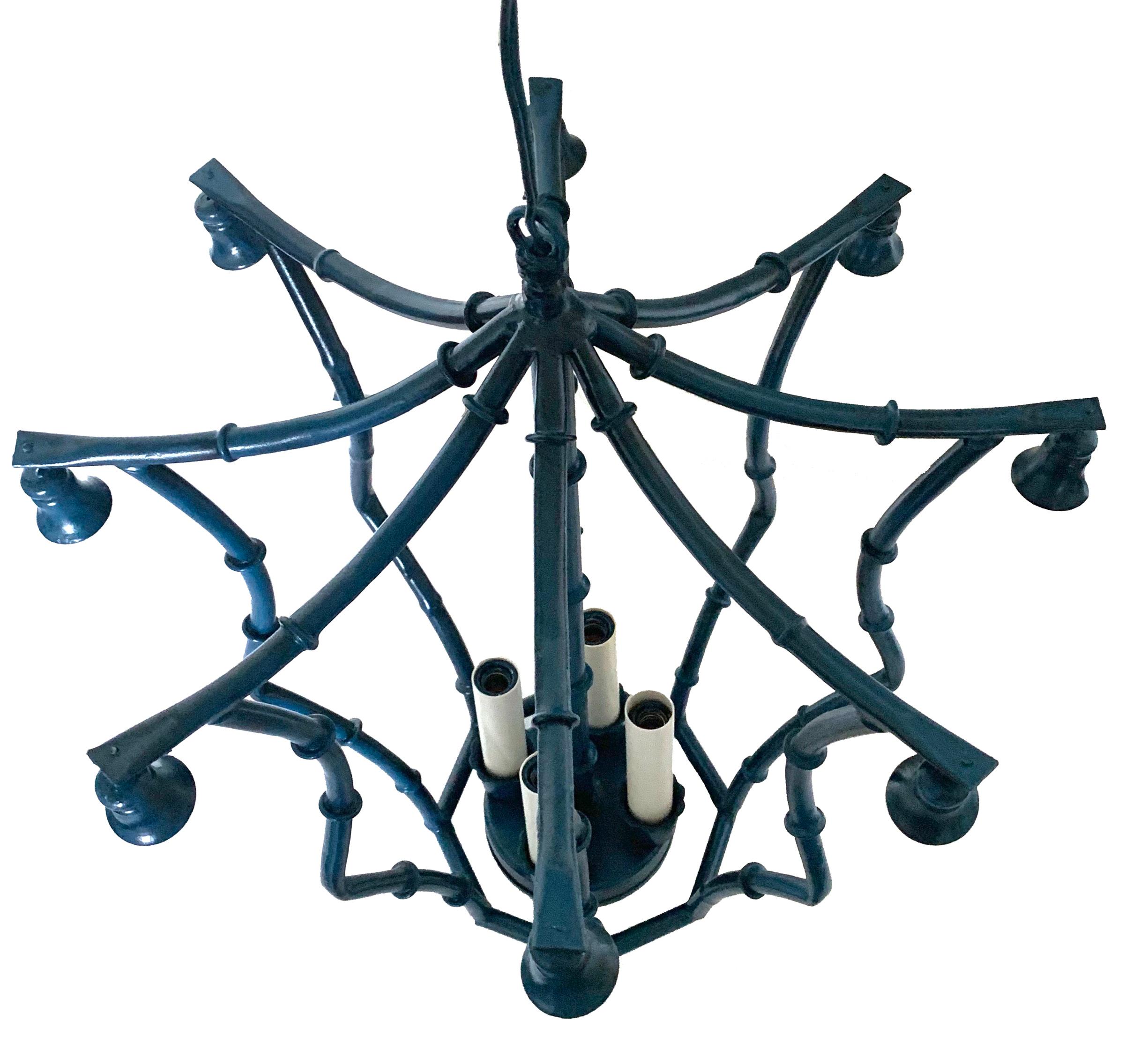 Custom painted bamboo-style chandeliers. Newly painted in Benjamin Moore 'Old Glory' (medium blue). Newly rewired. 36” L chain and canopy are included. Takes four chandelier bulbs.