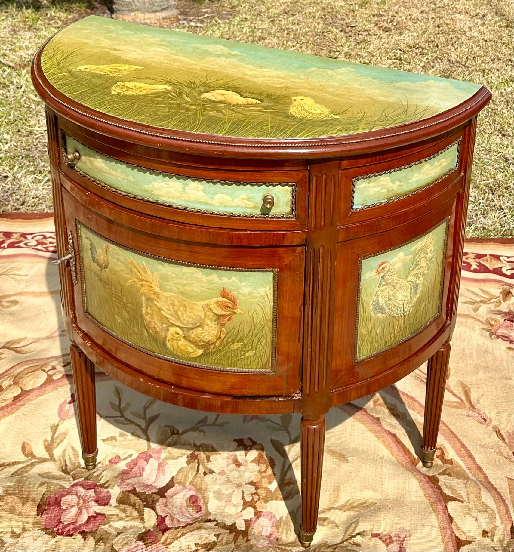 Painted Demilune Cabinet Commode Console

Absolutely gorgeous demilune hand painted cabinet console with upper drawer. It is decorated with the most charming paintings of chicks, hens and roosters on top and on all sides. The cabinet is raised on