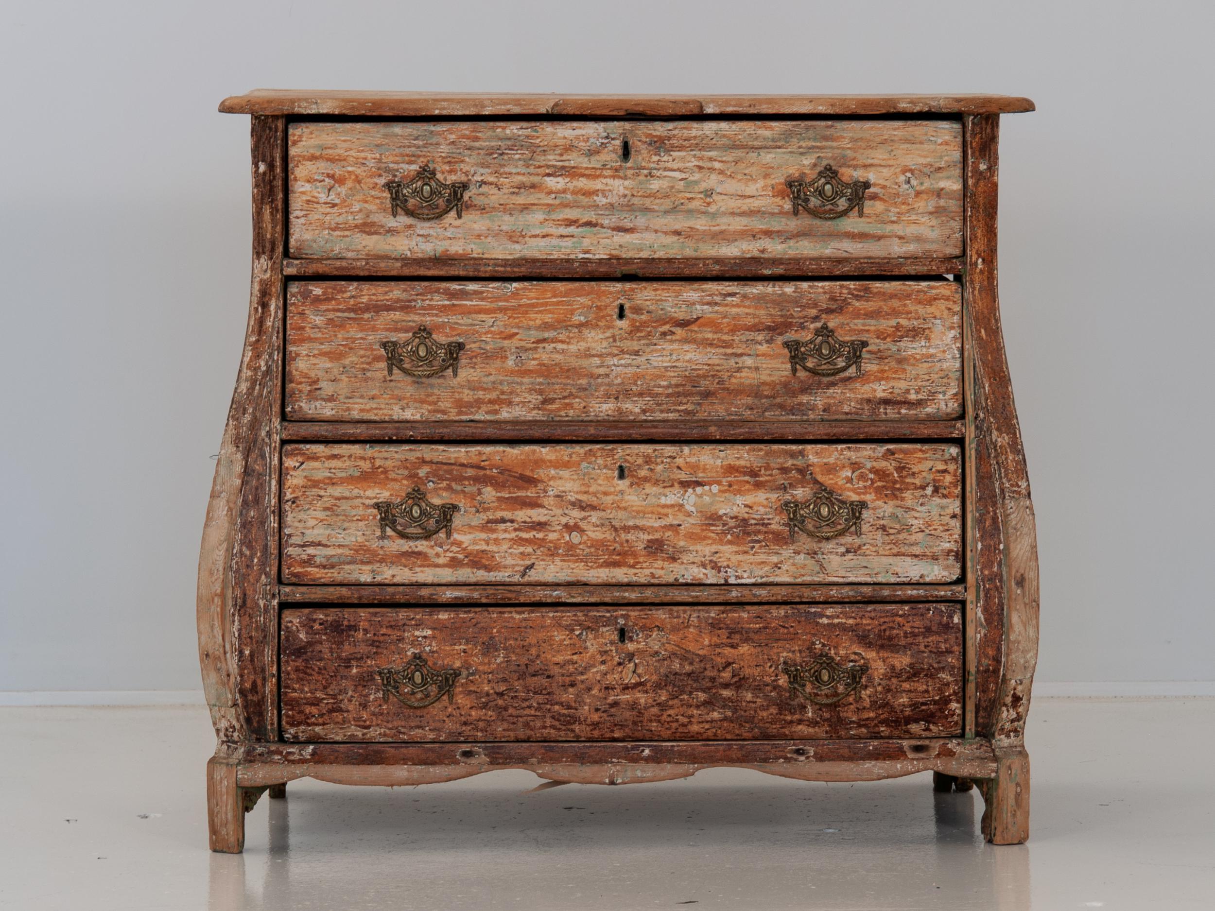 Dutch commode dry scarped to it's original painted surface. Unusual brass hardware featuring two lion heads holding a swag and branches. This is a simplified version of the iconic Dutch bombe commodes. Holland, circa 1800.