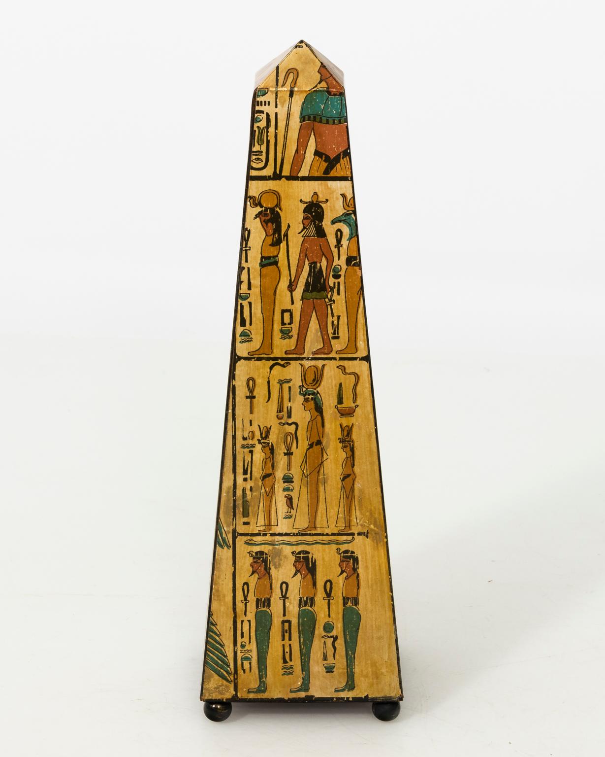 Contemporary painted Egyptian obelisk with hieroglyphs and Egyptian Gods.
 