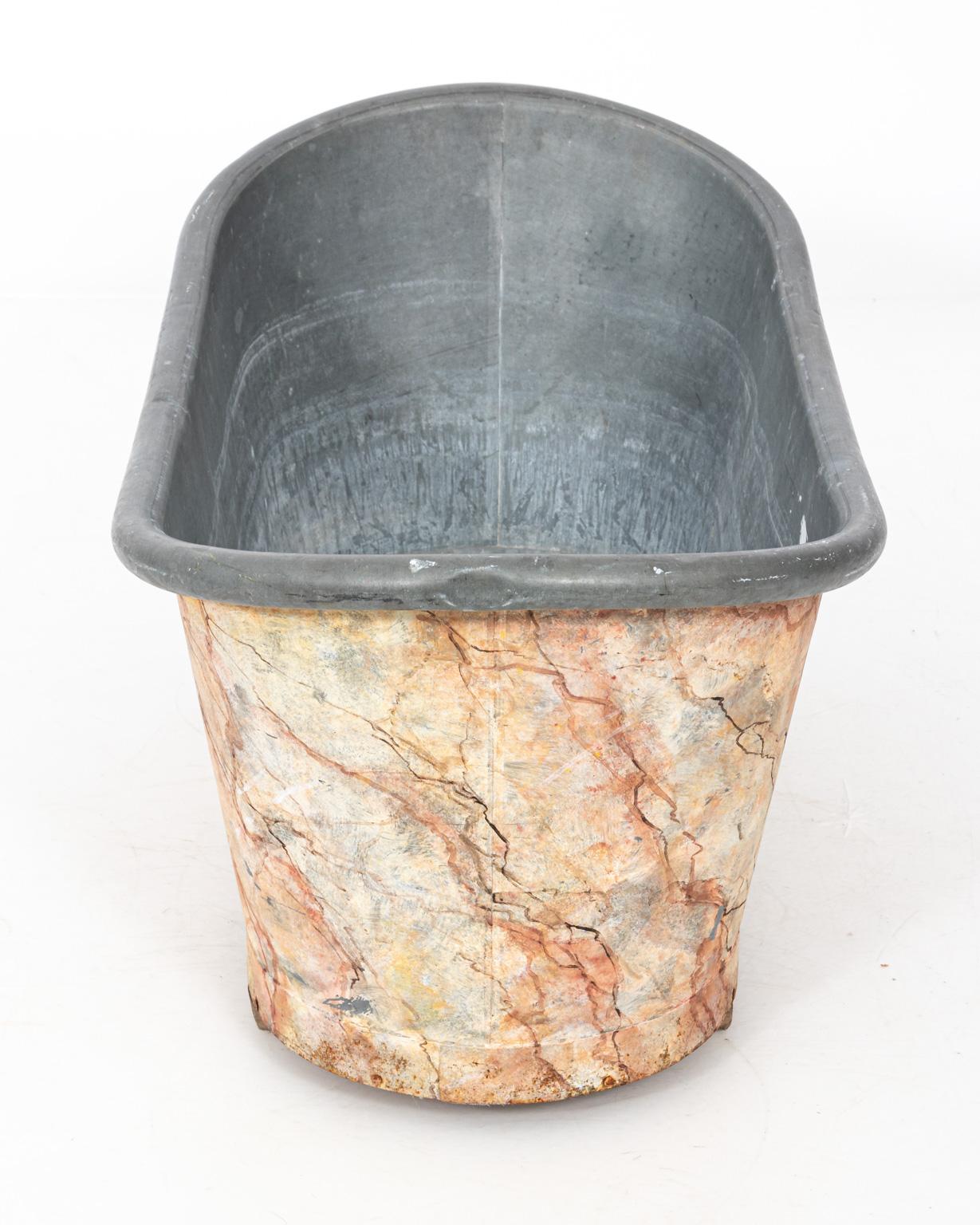 Painted faux marble zinc tub or large ice bucket, circa 20th century. Please note of wear consistent with age including water stains on the inside.