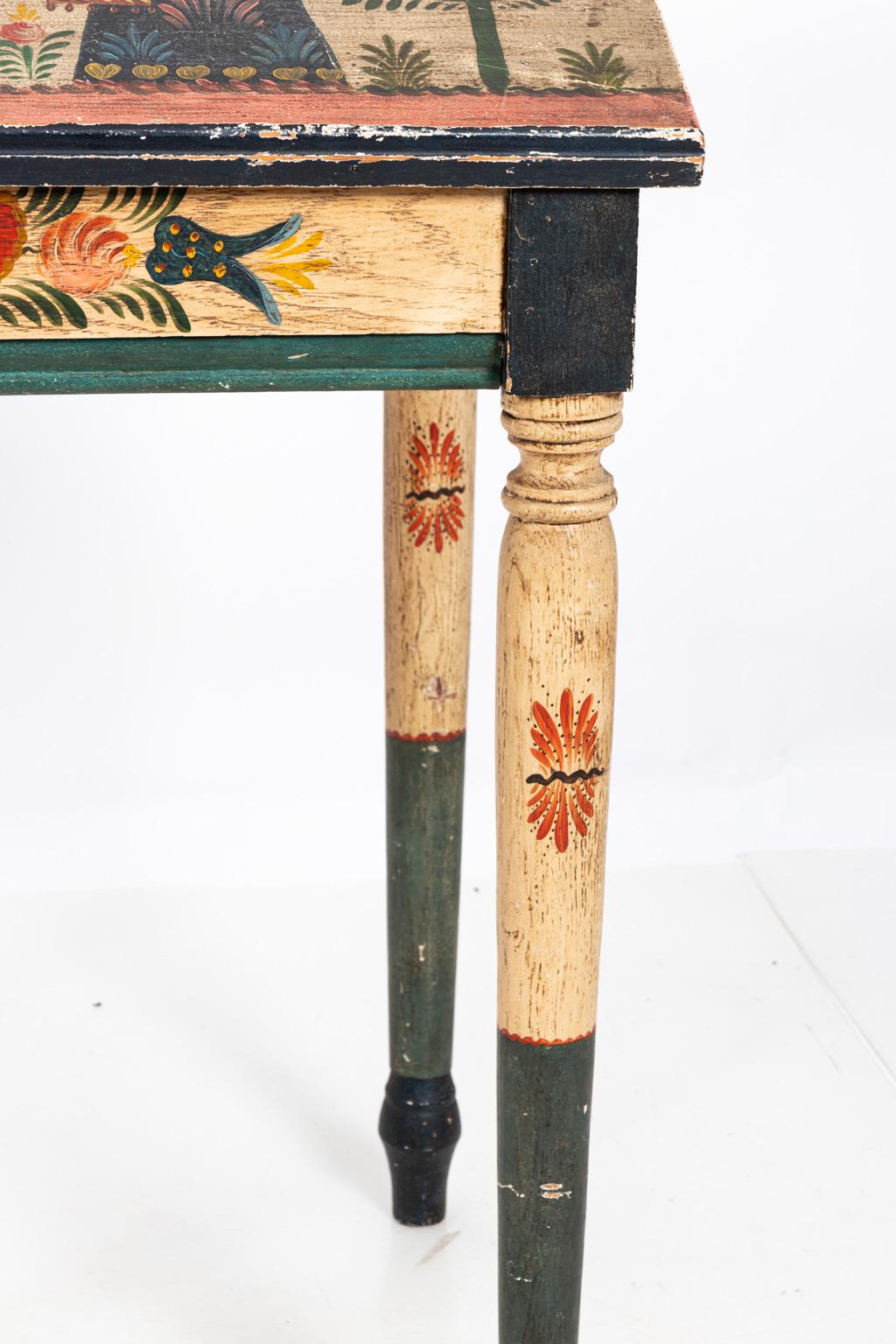 Painted Folk Art writing table detailed with flowers and figures throughout. Please note of wear consistent with age including paint loss and finish loss.