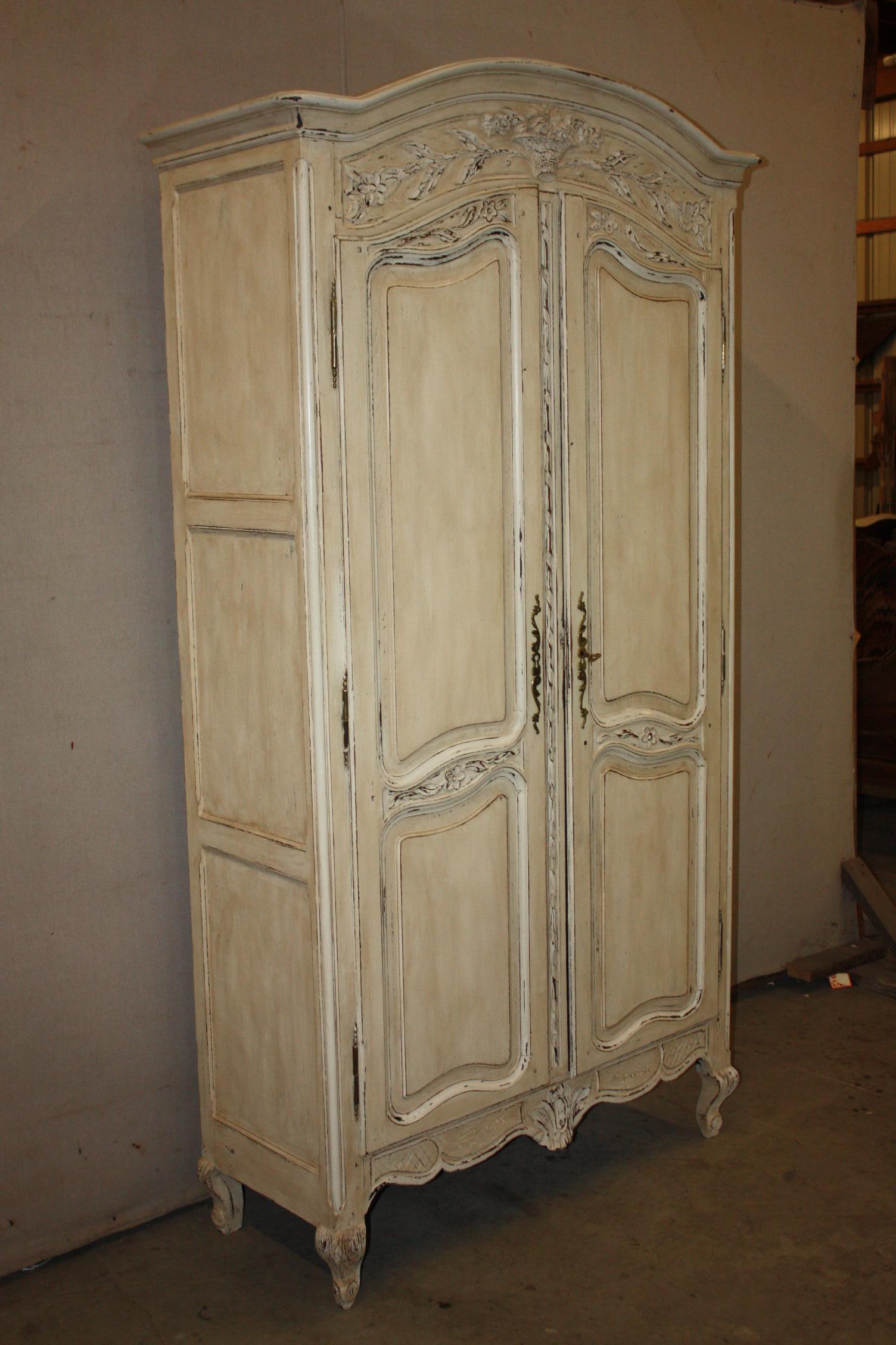 This is a very nice little painted French armoire that dates to the early 1900s. It is in great shape. It has three shelves that are each adjustable.