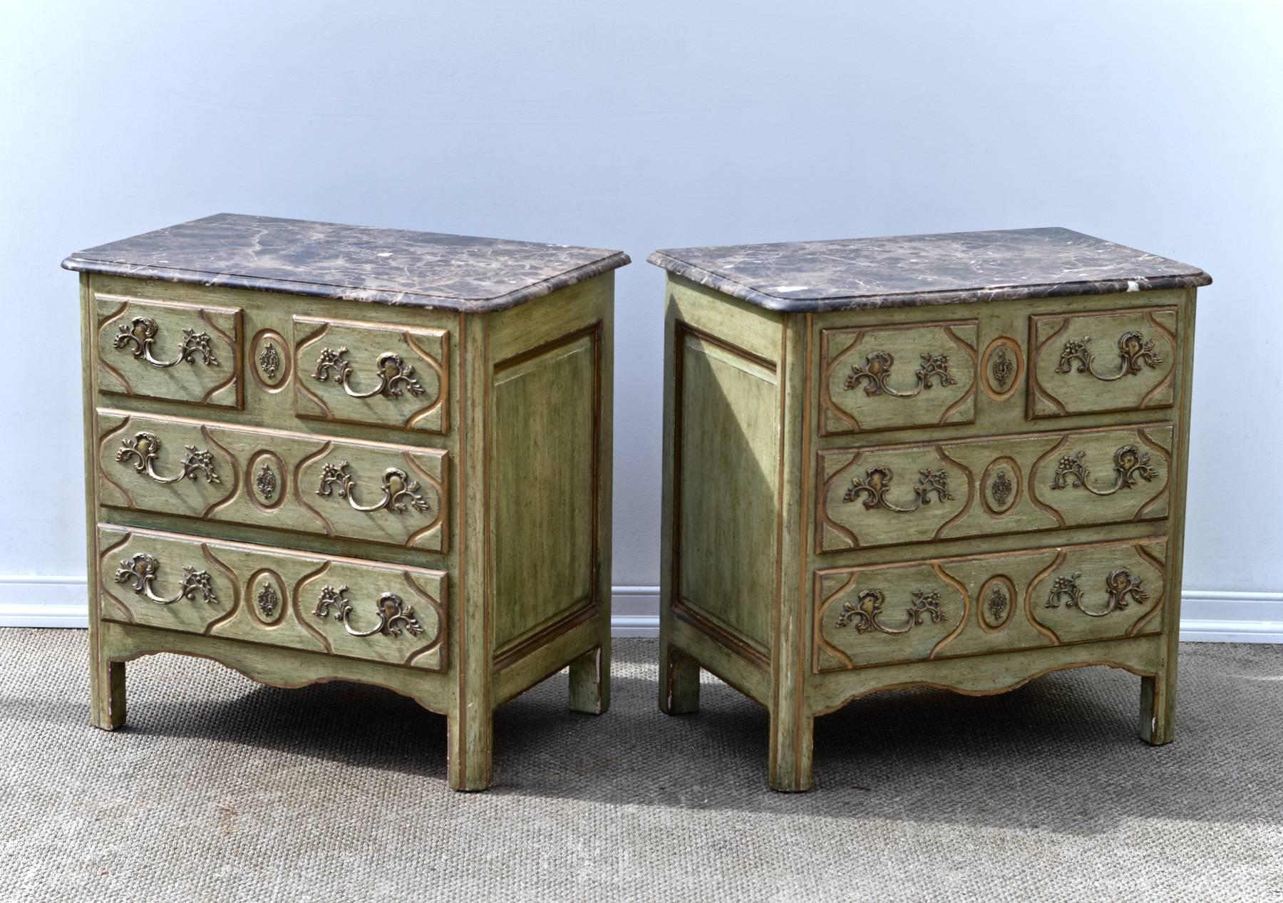 An outstanding pair of French Provincial nightstands having gorgeous dark grey marble top resting upon Louis XIV styled panelled chest with two short drawers above two longer drawers, circa 1965, the vintage commodes are sturdy and work well