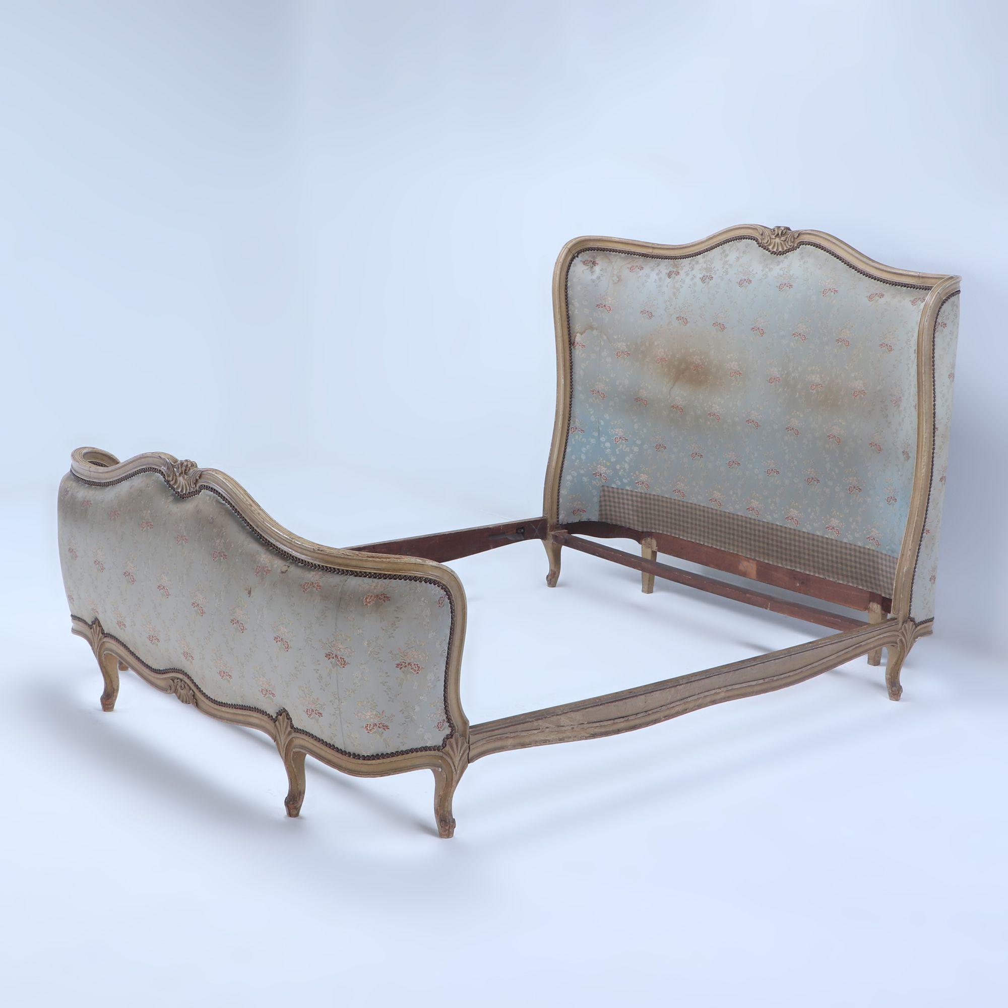 A painted French Louis XV style bed having a curved footboard in old fabric C 1920. Interior Dimensions: 81