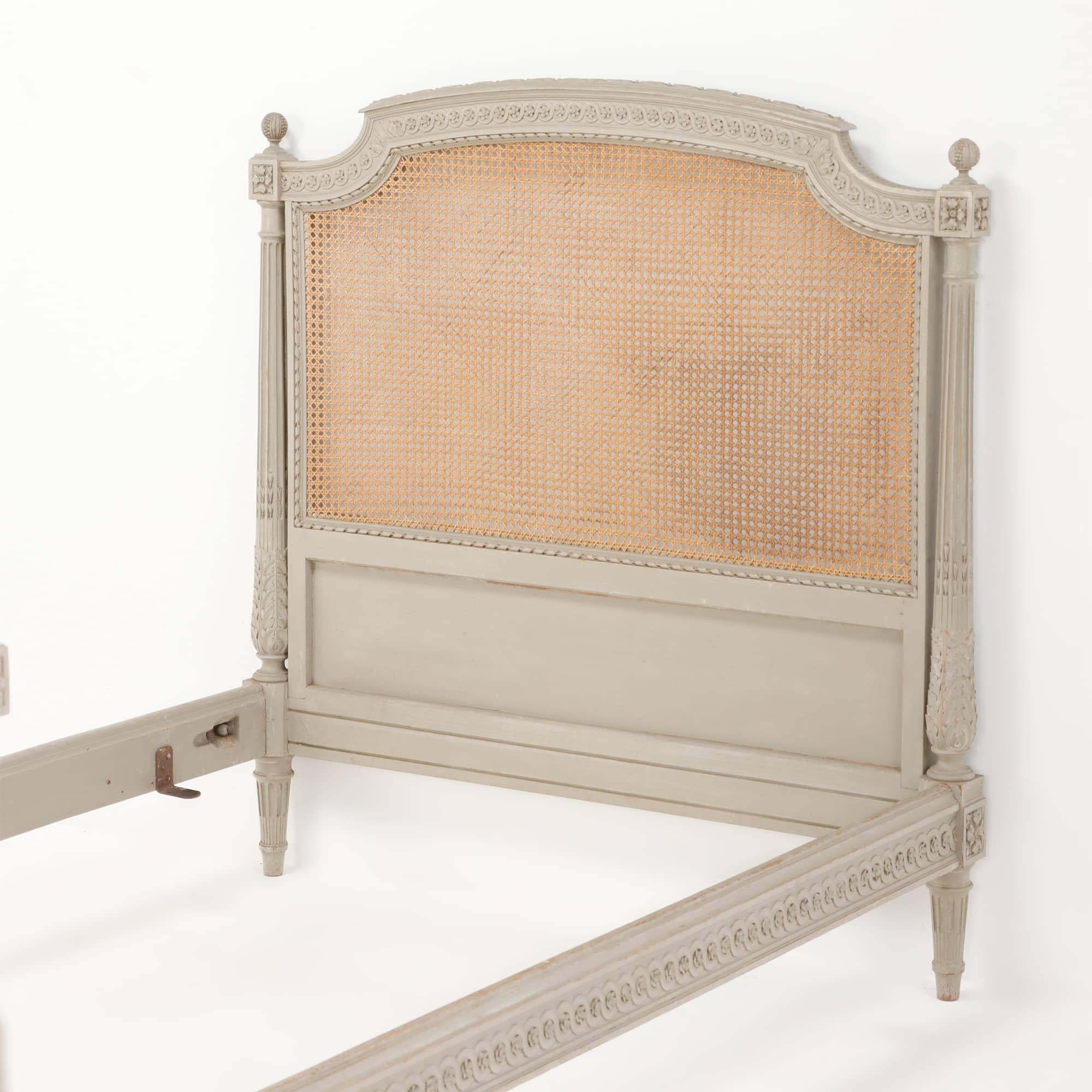 Carved Painted French Louis XVI style cane youth or twin size bed.