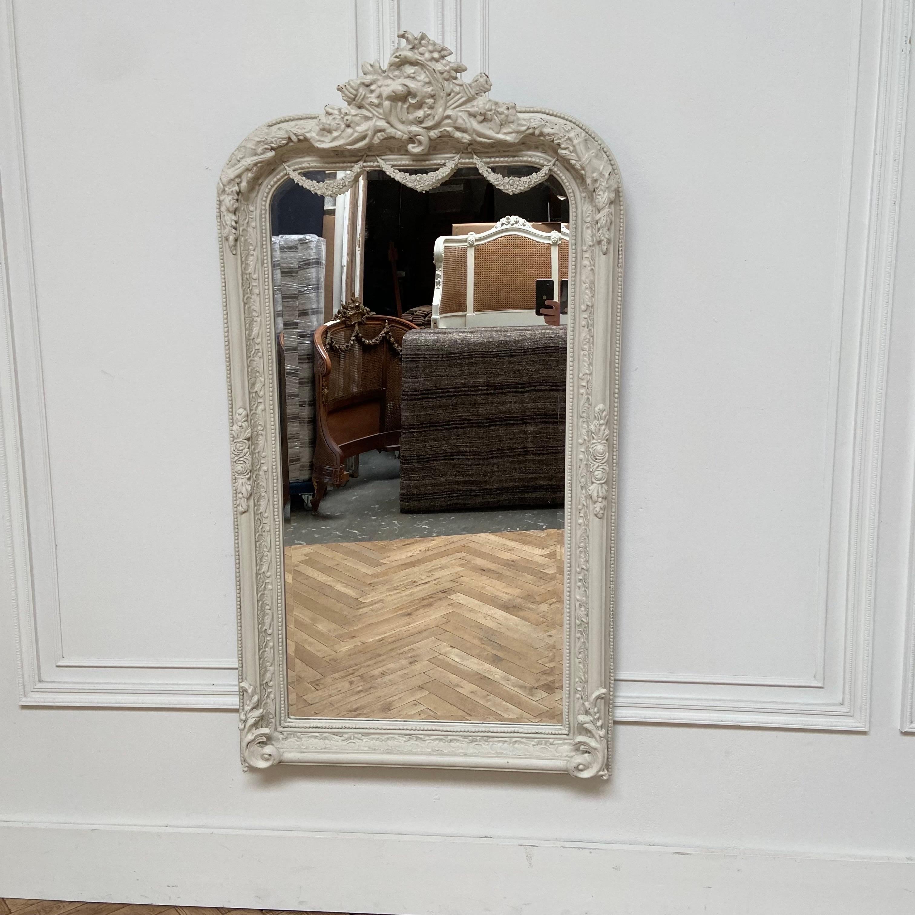 Beautiful reproduction of an antique French style.
Large cartouche with rose swags.
mirror 34”W x 61”H x 3”D
Made from wood and resin materials. Painted in a soft oyster white with subtle distressed edges and antique patina.