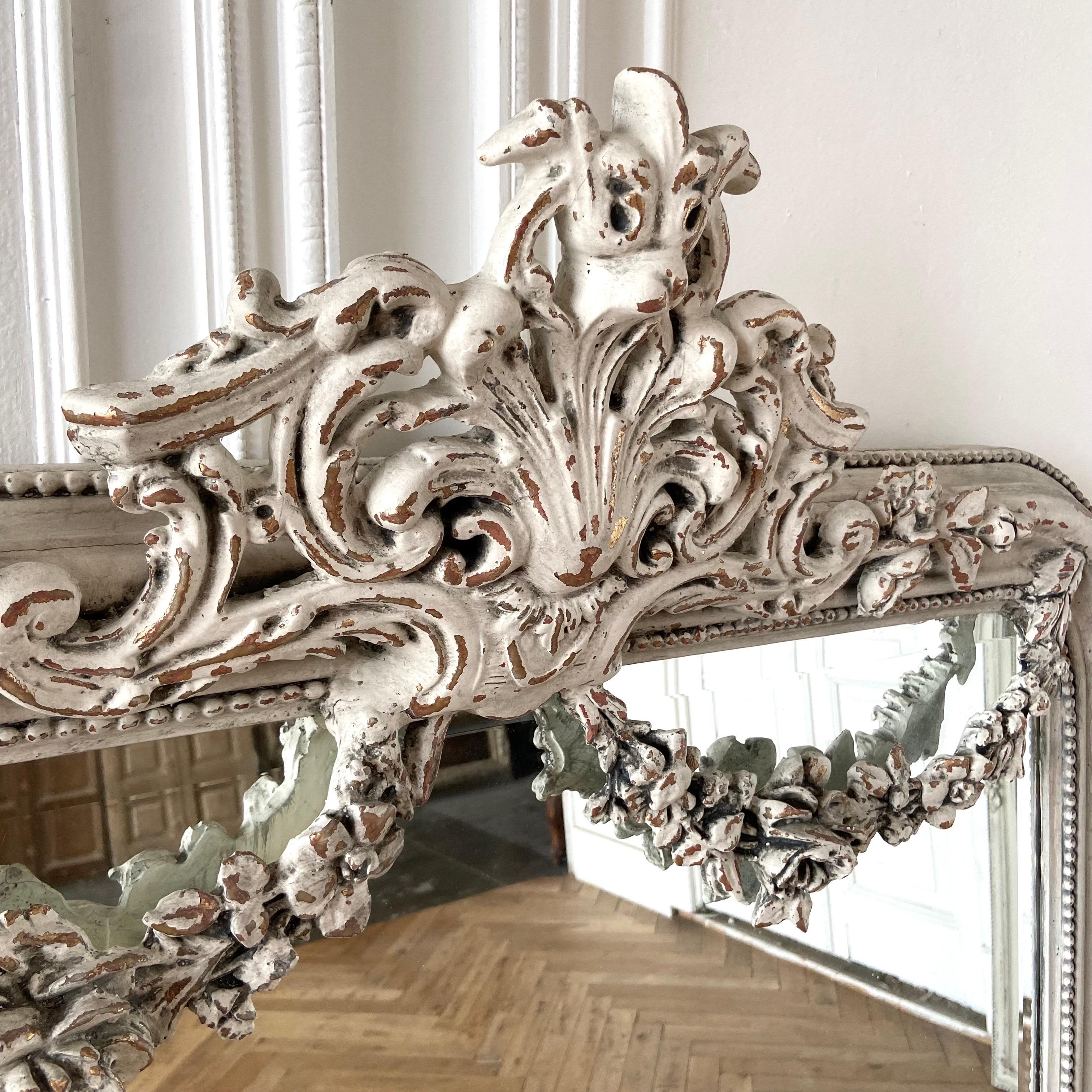 Beautiful reproduction of an antique French style. Large cartouche with rose swags. Made from wood and resin materials. Painted in a soft oyster white with subtle distressed edges and antique patina.
rose swag mirror 38-1/2”w x 59”h
Multiple