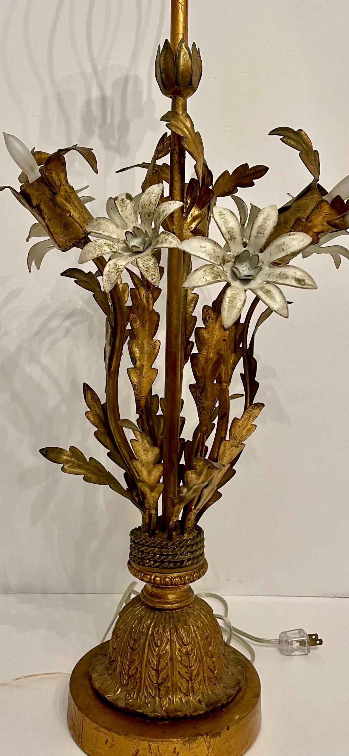 Painted gilt Italian lamp. Tole painted off white flowers and gilt leaf design lamp with single medium base socket on top with three candelabra base sockets in the flowers. Rewired with brass socket that can be switched to allow only the top bulb to