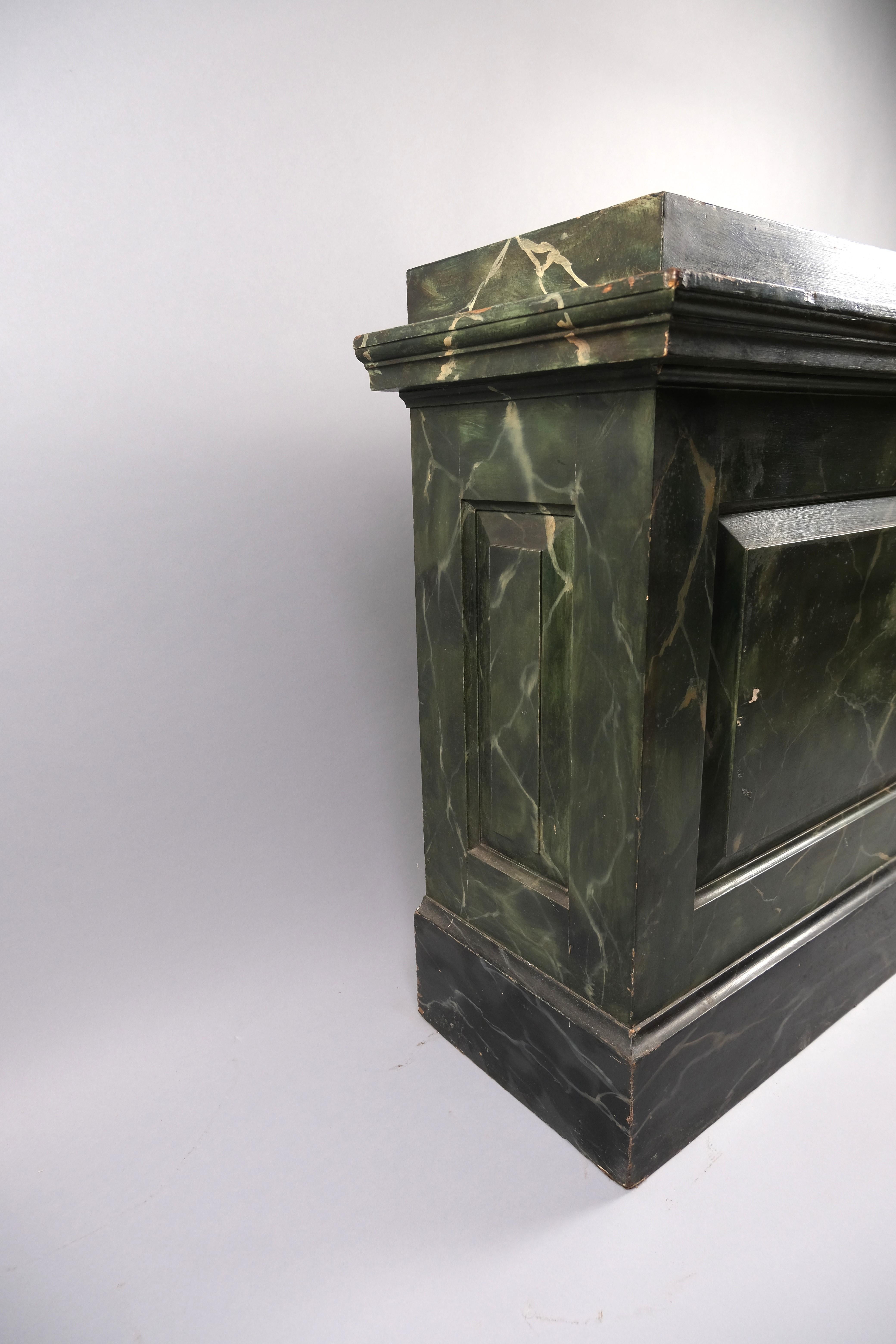 Hutton-Clarke Antiques is delighted to present a genuine work of art from the past: an original hand-painted marble pedestal dating back to approximately 1870. This exquisite piece showcases intricate craftsmanship, featuring a striking faux green