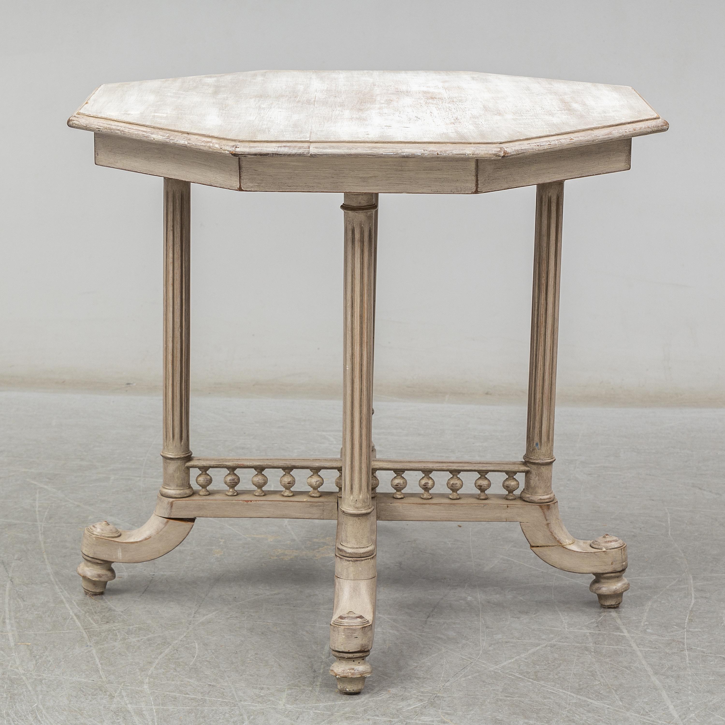 A painted Gustavian table from Sweden, second half of the 19th century.
Later painting with beautiful patina. Stain on top, feet have been repaired. Last image shows leg before repair.
