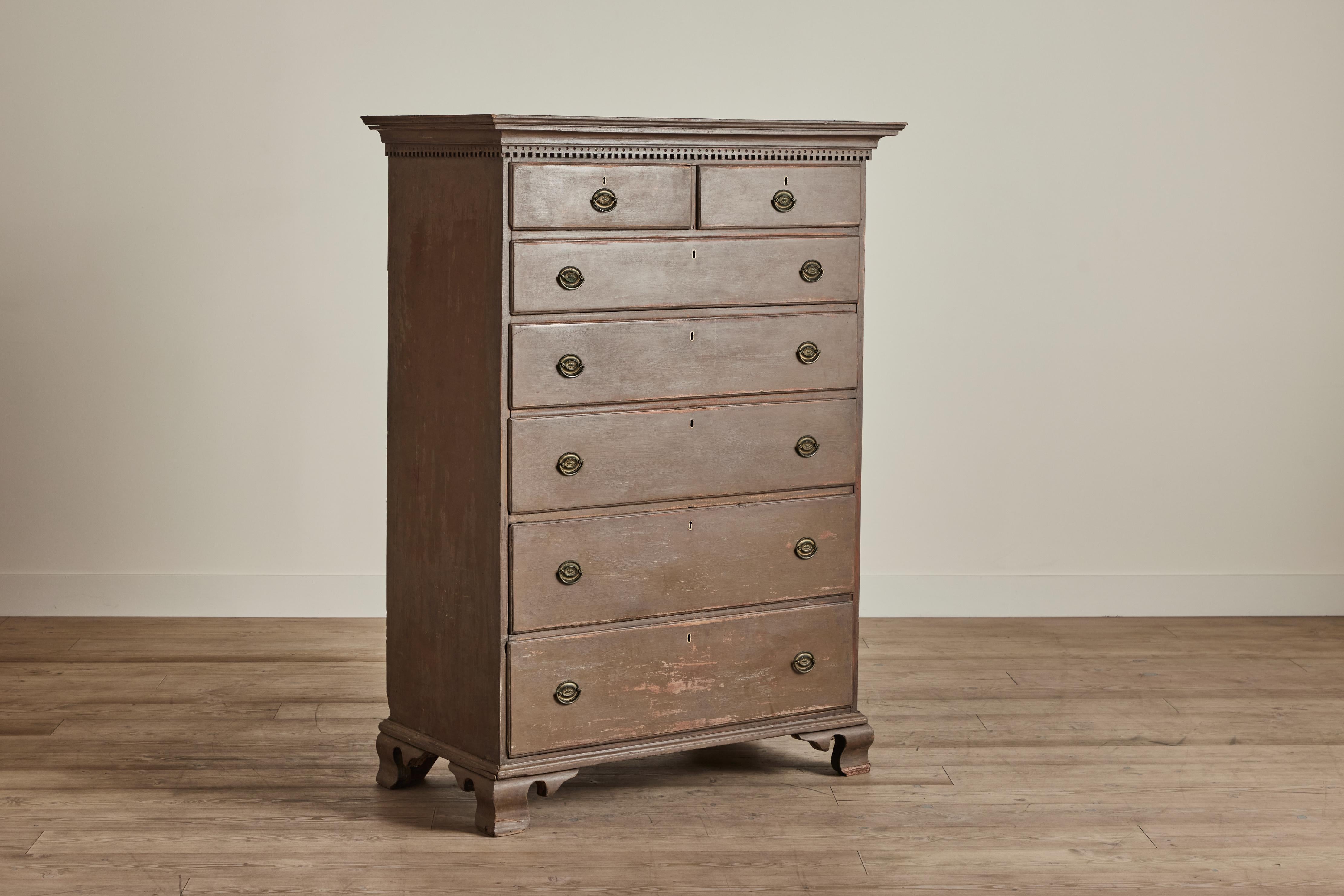 Painted nineteenth century Hepplewhite style highboy dresser. This stately case good has seven drawers for ample storage. Some wear on wood and finish that is consistent with age and use. 