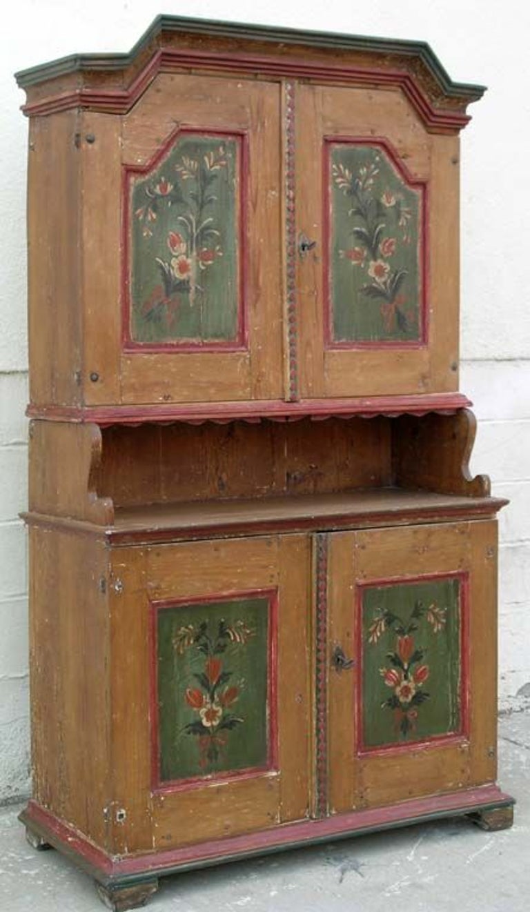 Buffet in 2 parts dated 1820. We have carefully scraped off later layers of paint to reveal the original floral design on door panels. This is a great original piece! Locks work.



   