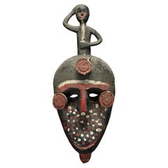 Painted Ibibio Polychrome Face Mask with Figure on Top, Nigeria Africa colorful