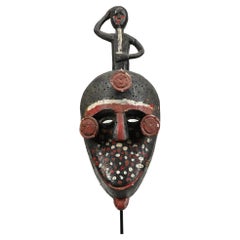 Antique Painted Ibibio Polychrome Face Mask with Figure on Top, Nigeria Africa colorful