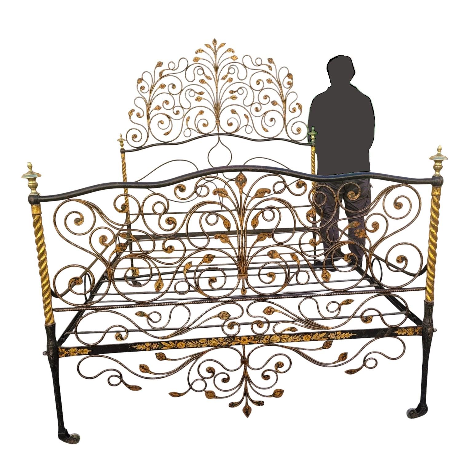 Beautiful iron bed painted in brown-burgundy, with a very rich decoration of intertwined flowers and foliage, enhanced with gold.  

Good general condition, wear to the patina, small old restorations; 2 volutes are missing at the foot of the bed.  