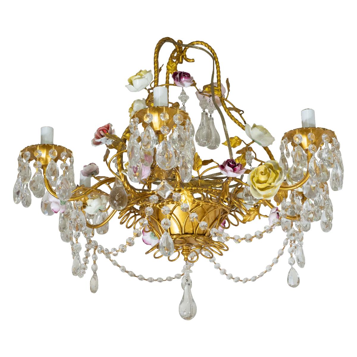 Gold painted iron chandelier with faceted crystal beads, drop elements and ceramic flower details.