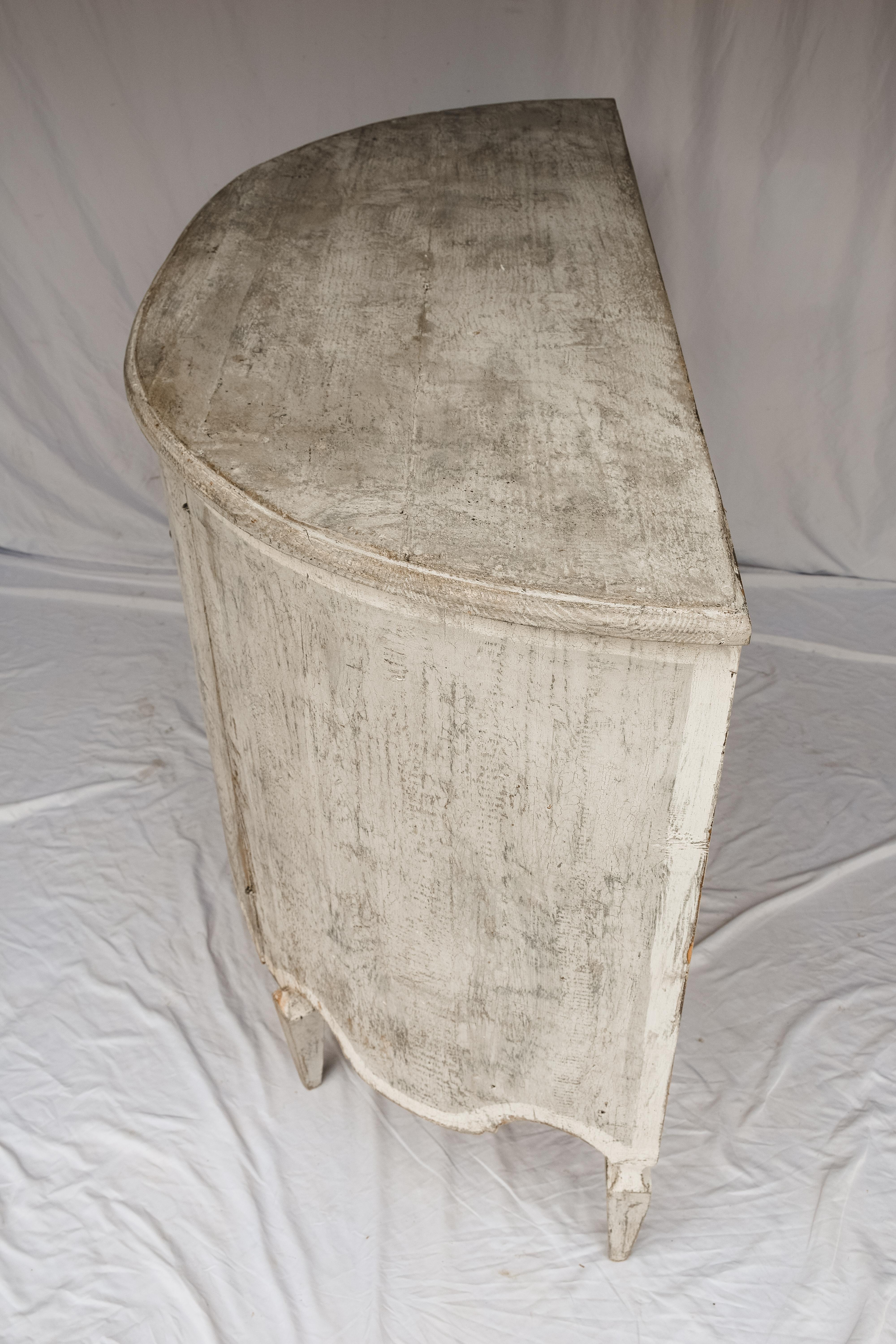 This Demilune Commode boasts a graceful curve in a beautiful silhouette that works anywhere from the foyer to the bedroom. We also love it paired beside a doorway or for serving in the dining room. It has a beautiful painted rustic finish and it is