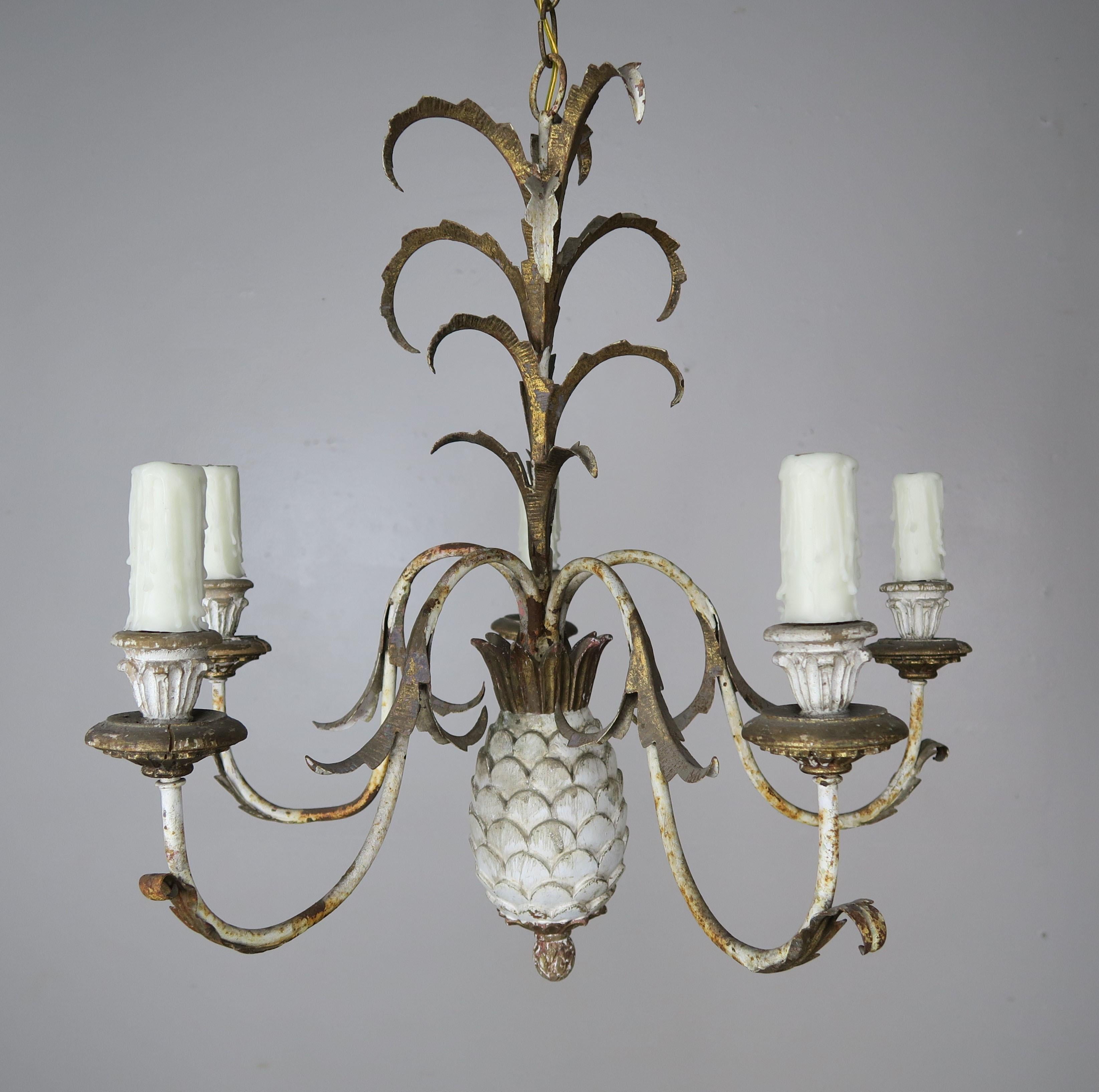 Italian painted wood & metal pineapple shaped four light chandelier. The fixture is newly rewired with drip wax candle covers. Includes chain & canopy.