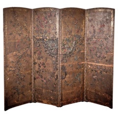 An exquisite early 19th Century hand painted four-fold leather room divider.
