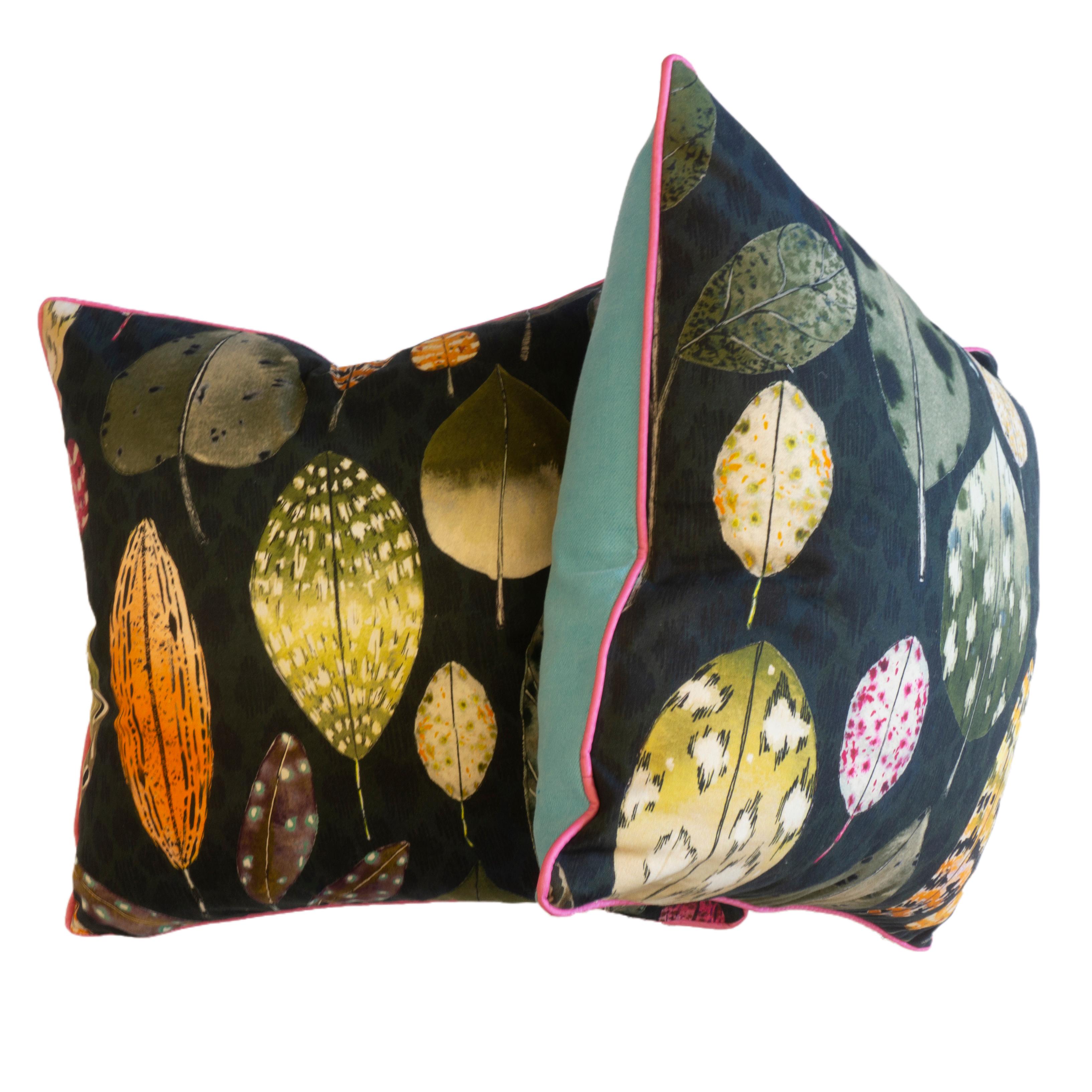 Escape into nature with the painted leaves throw pillows. Made with designer Guild’s Tulsi Aubergine fabric that features a highly ornate leaf print design on soft brushed cotton cloth. Bordered in pink piping and green/blue backing. All pillows are