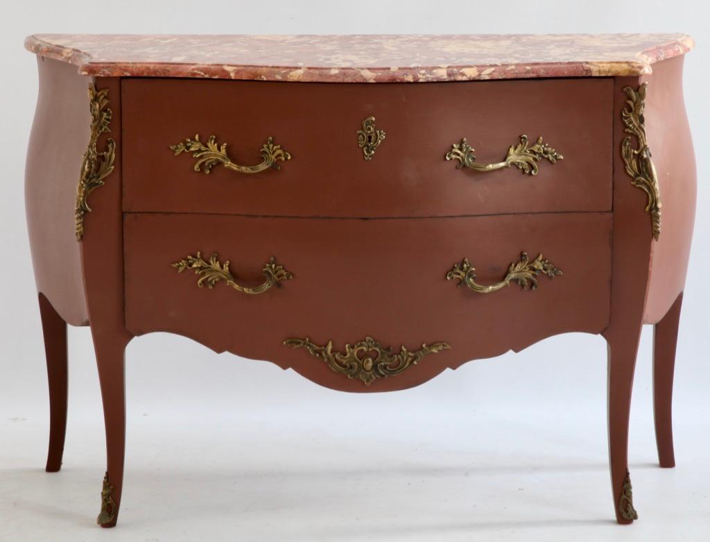 Louis XV style commode bombe with bronze ornaments and marble top.
elegant and fluid.