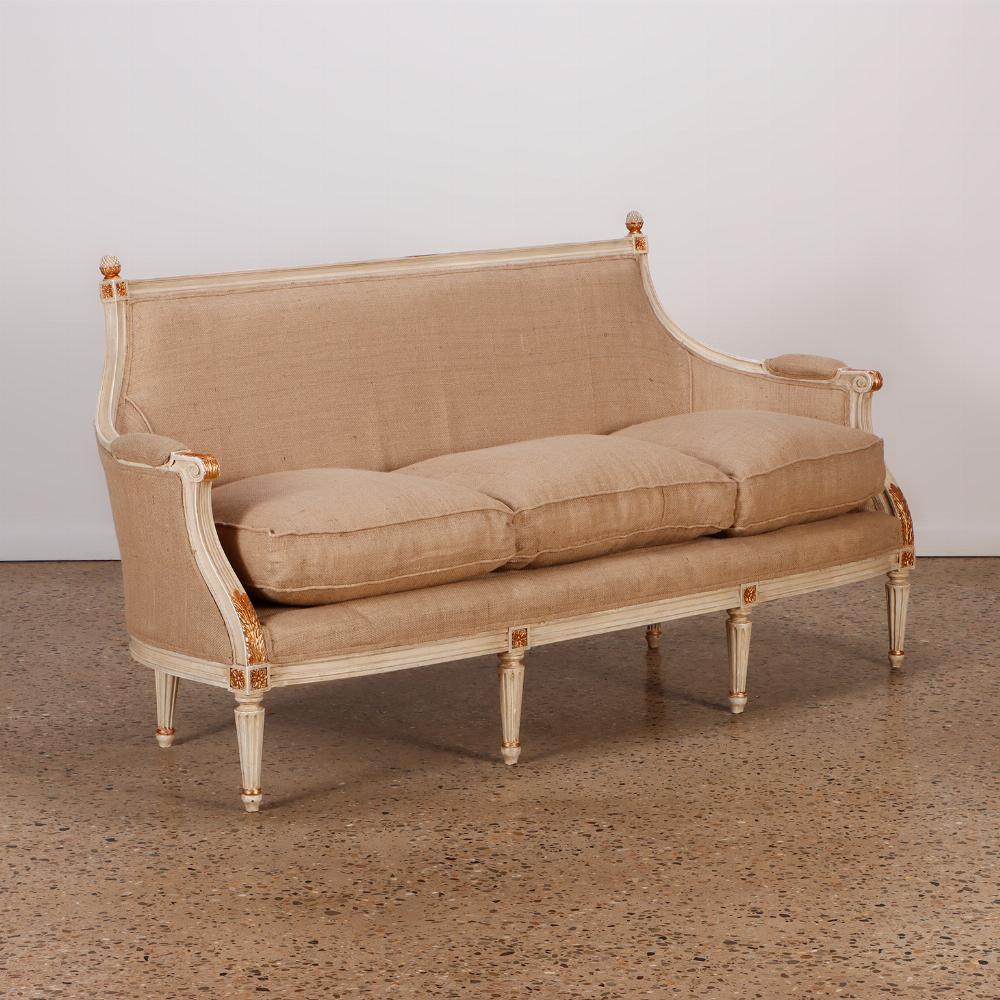 Painted Louis XVI style six leg sofa circa 1940 with gilt hightlights and new fabric