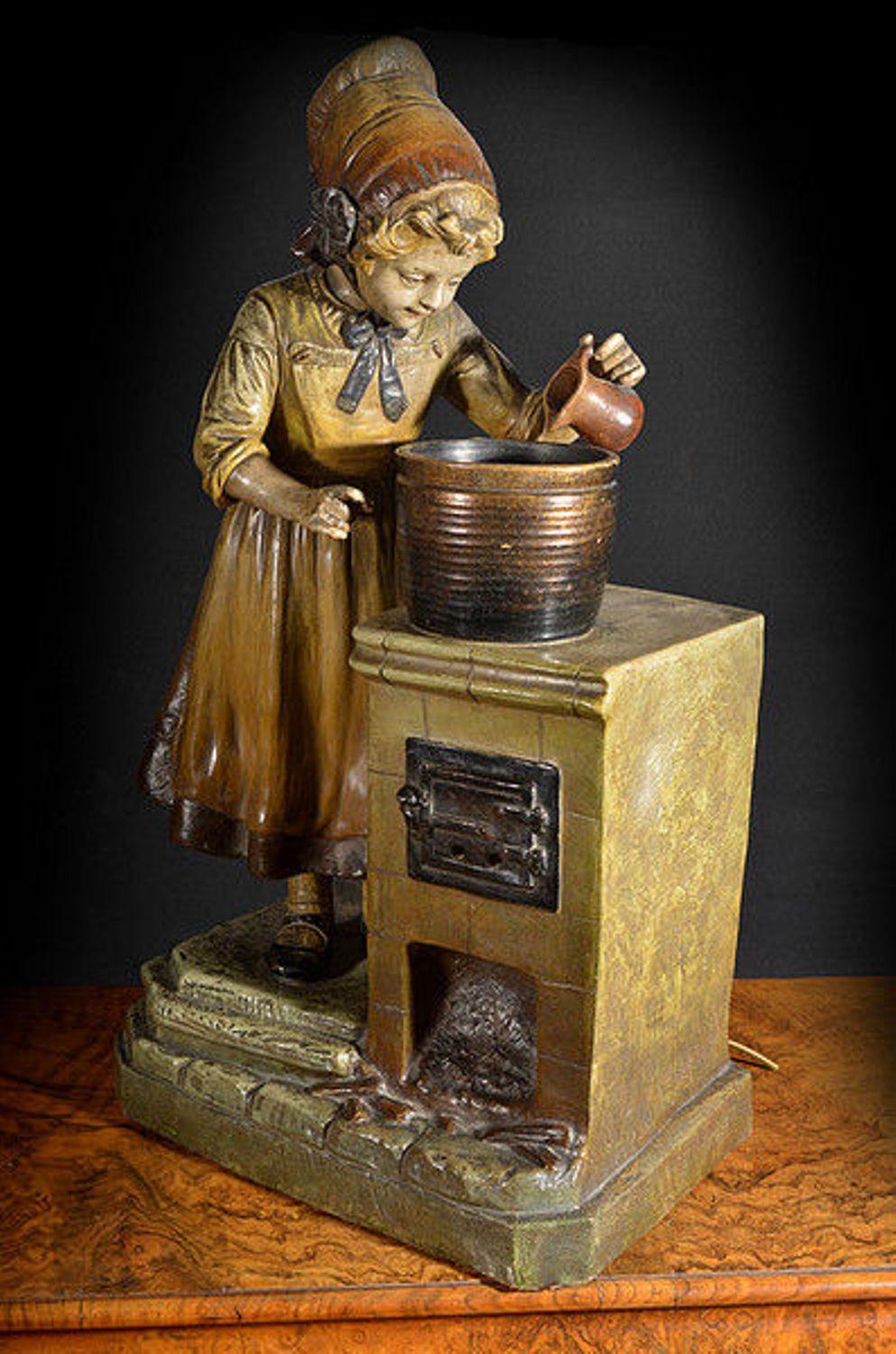 Painted Metal Lamp in the Form of a Young Girl at a Stove In Fair Condition For Sale In Hemel Hempstead, Hertfordshire