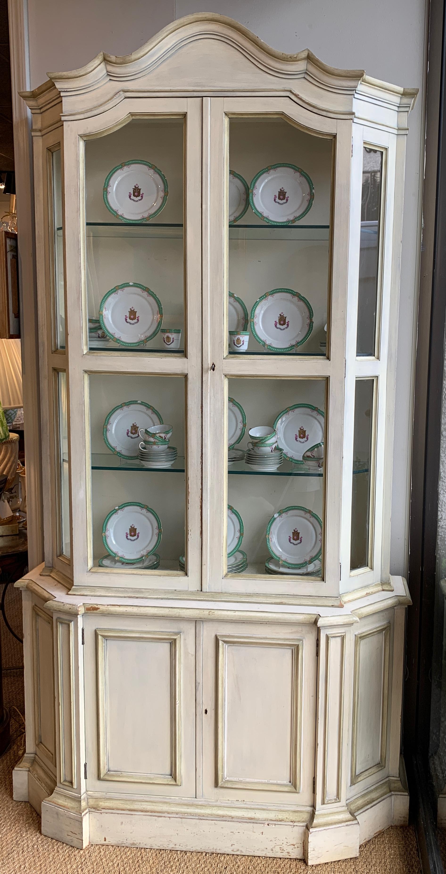 how to decorate the top of a curio cabinet
