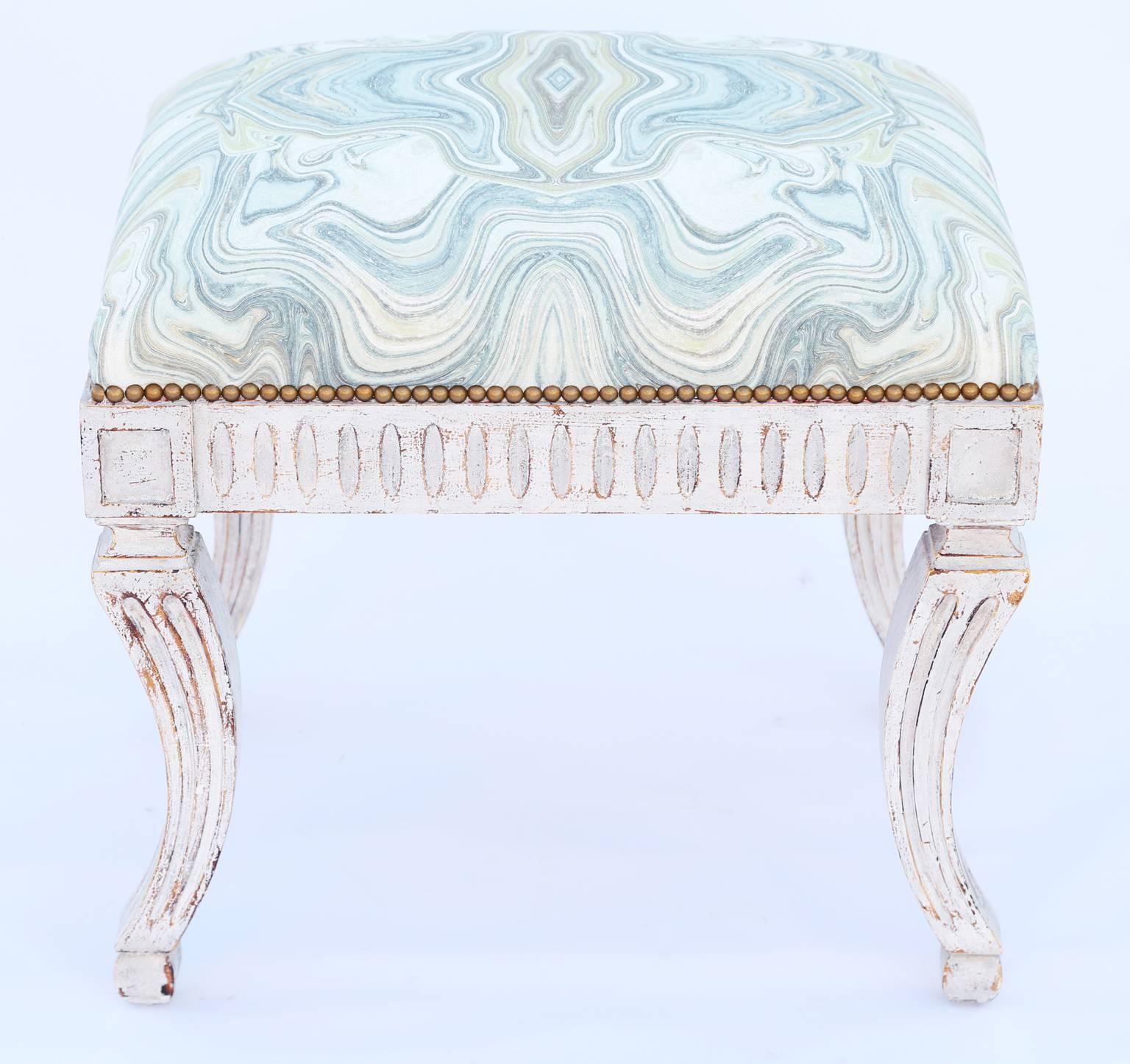 Bench, having a stuff-over seat with nailheads, on painted frame, showing natural wear to finish, its fluted apron, flanked by squared corners, raised on fluted, sabre legs, ending in block feet. 

Stock ID: 1132

 