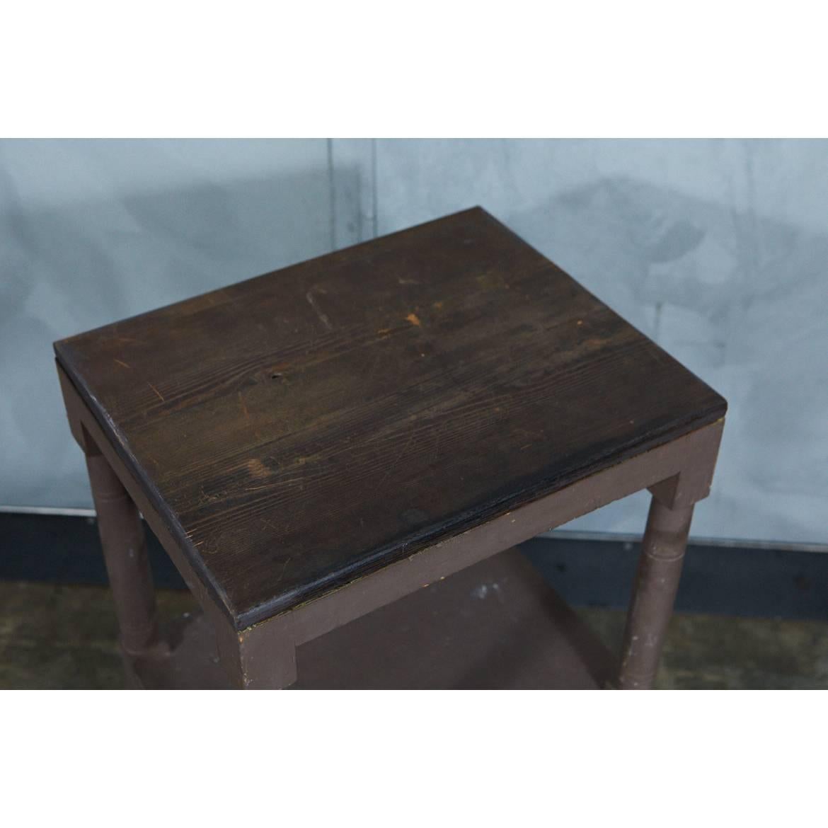 This American pine washstand is painted a nice brown with a stained wood top. It has nicely turned legs and feet with squared elements as well. 




 