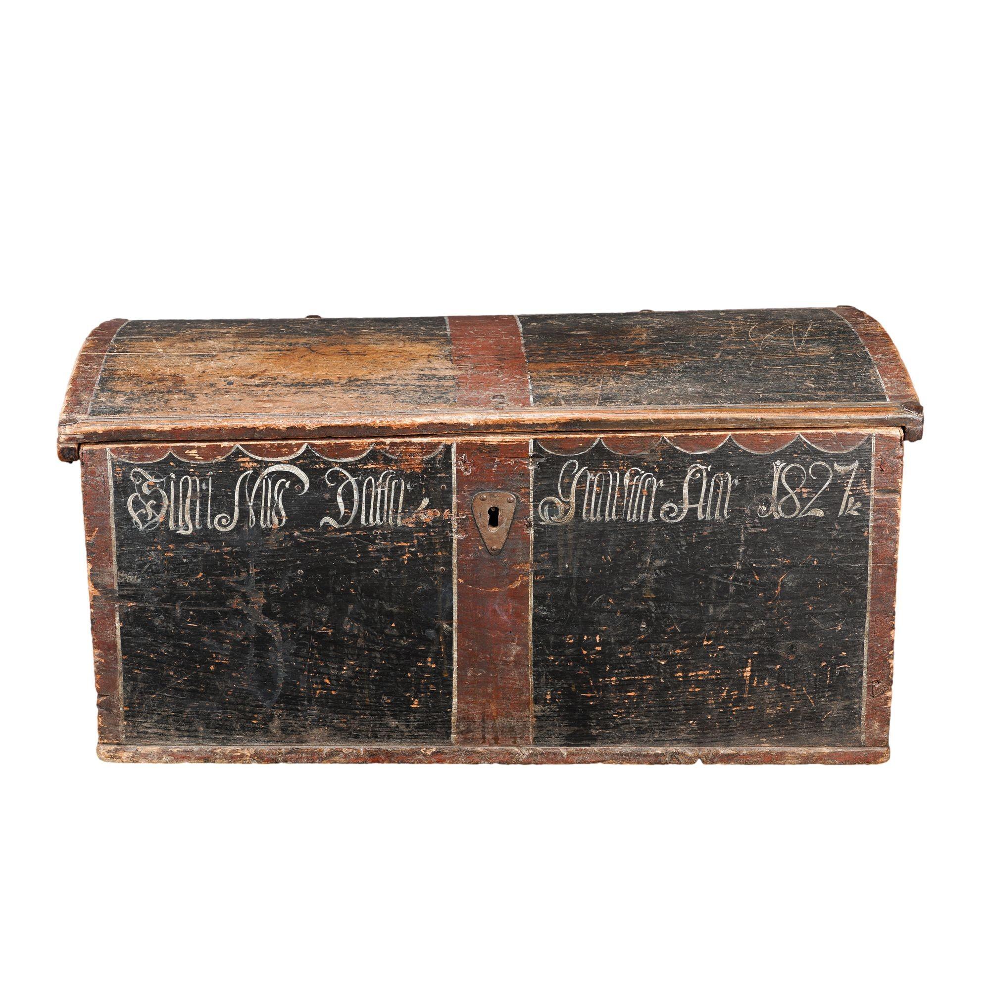 Painted Norwegian pine immigrant trunk with coffer top and mounted with a pair of hand wrought iron hinges. The trunk is assembled with dove tailed construction, hand forged rose head nails, and fitted with a pair of iron bail handles. A till with