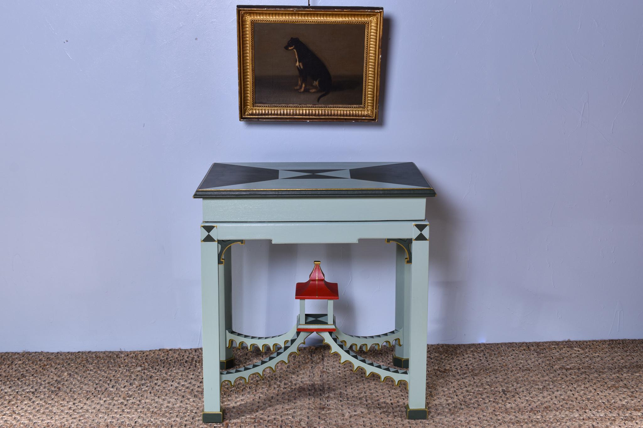 A wonderful bespoke side table featuring a sculpted pagoda with four adjoining stretchers, handcrafted by a master cabinet maker in North Yorkshire.

This table is made from solid North American tulip wood and hand-painted in our chosen colour way