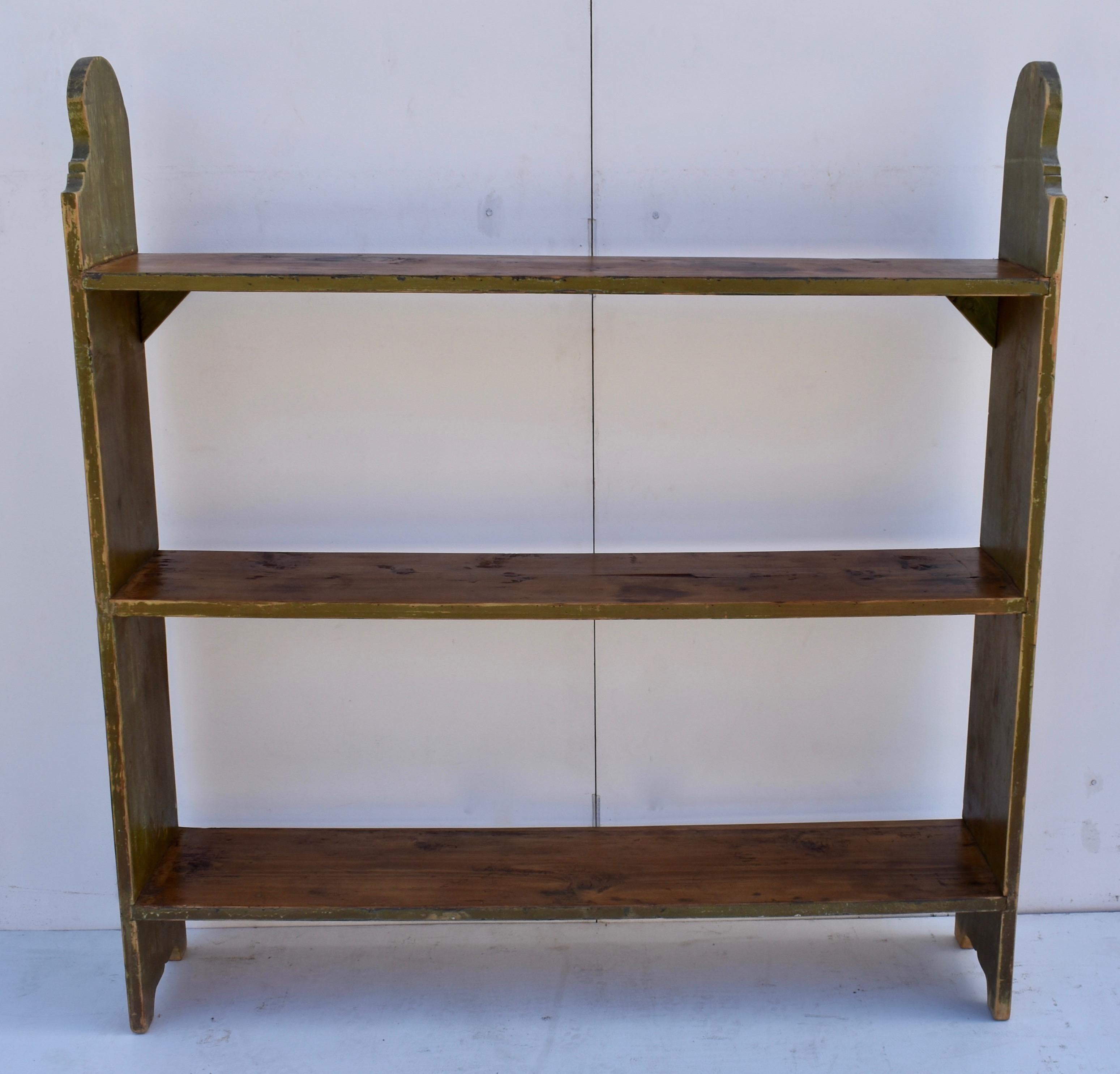 This useful five board shelf unit was designed to hold pots and pans, buckets, and other large vessels both empty and full. It needed sturdy construction so the top and bottom shelves are tenoned all the way through the sides and the middle shelf is