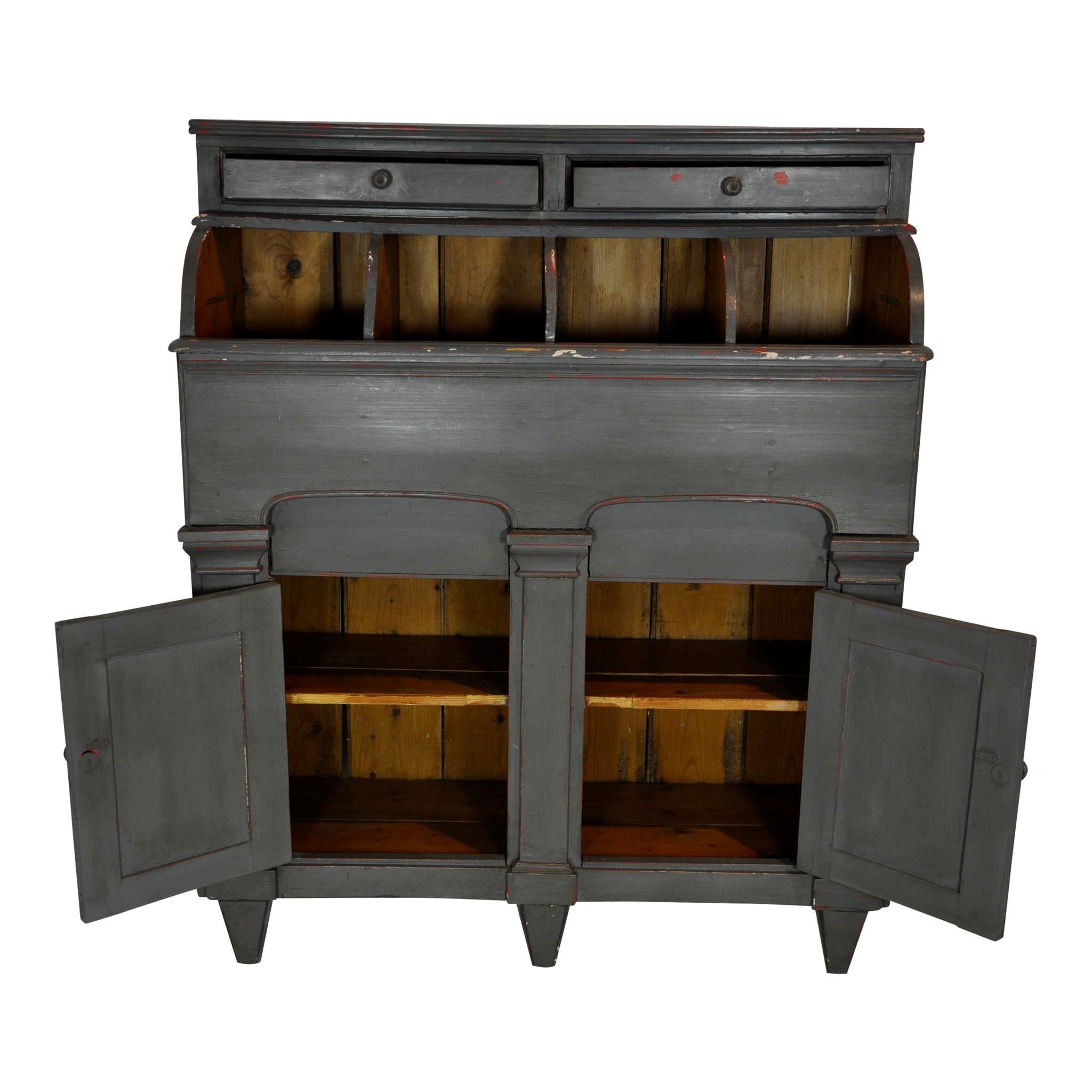 Can't you picture this cabinet with storage bins in a small general store? There are four deep bins, which are covered by an arched lid that lifts off. A single shelf inside the double doors and two small drawers above the bins provide additional