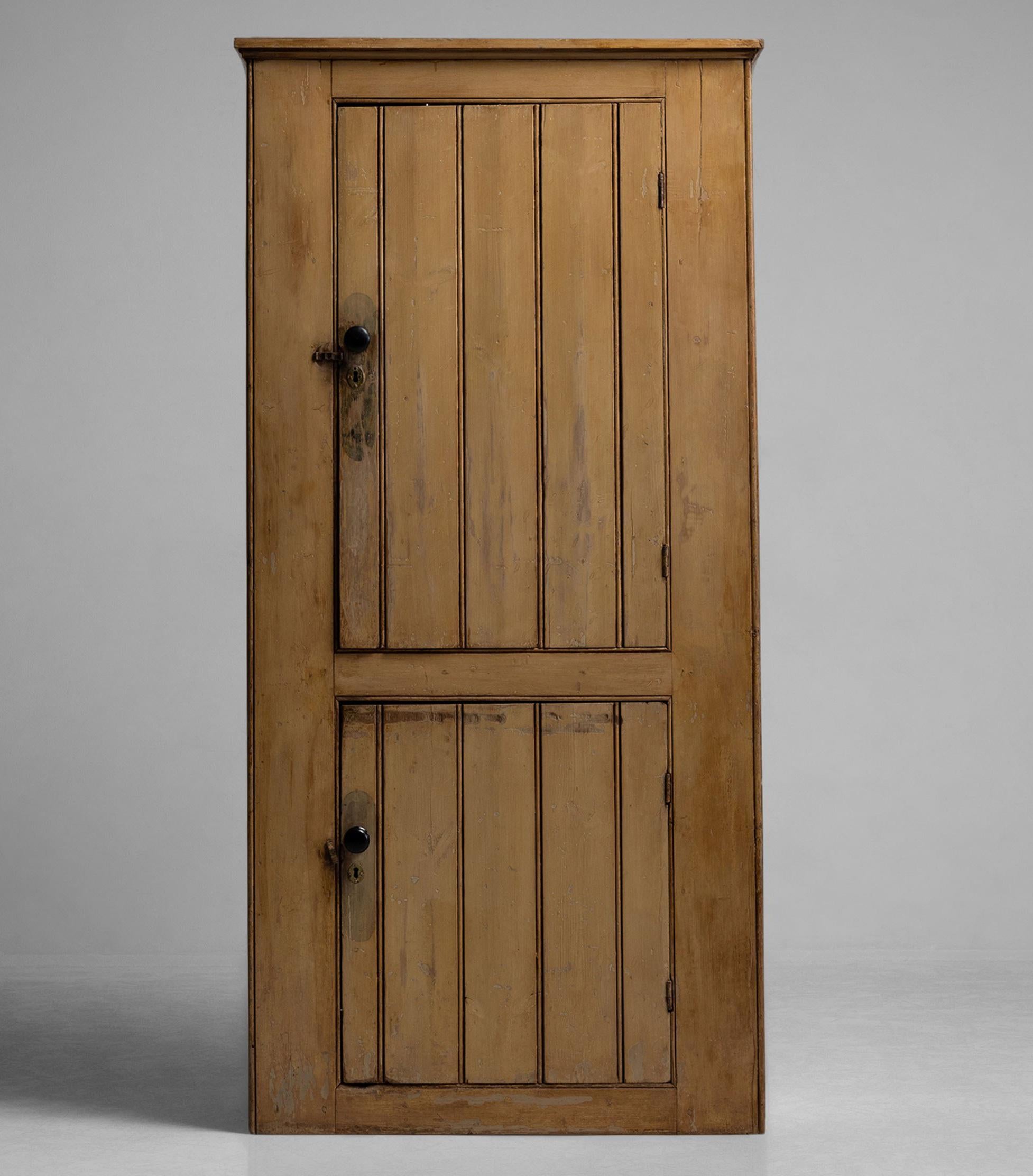 Cupboard with two doors and wooden knobs, with original period finish.


Measures: 38.5” W x 14” D x 81” H.

 