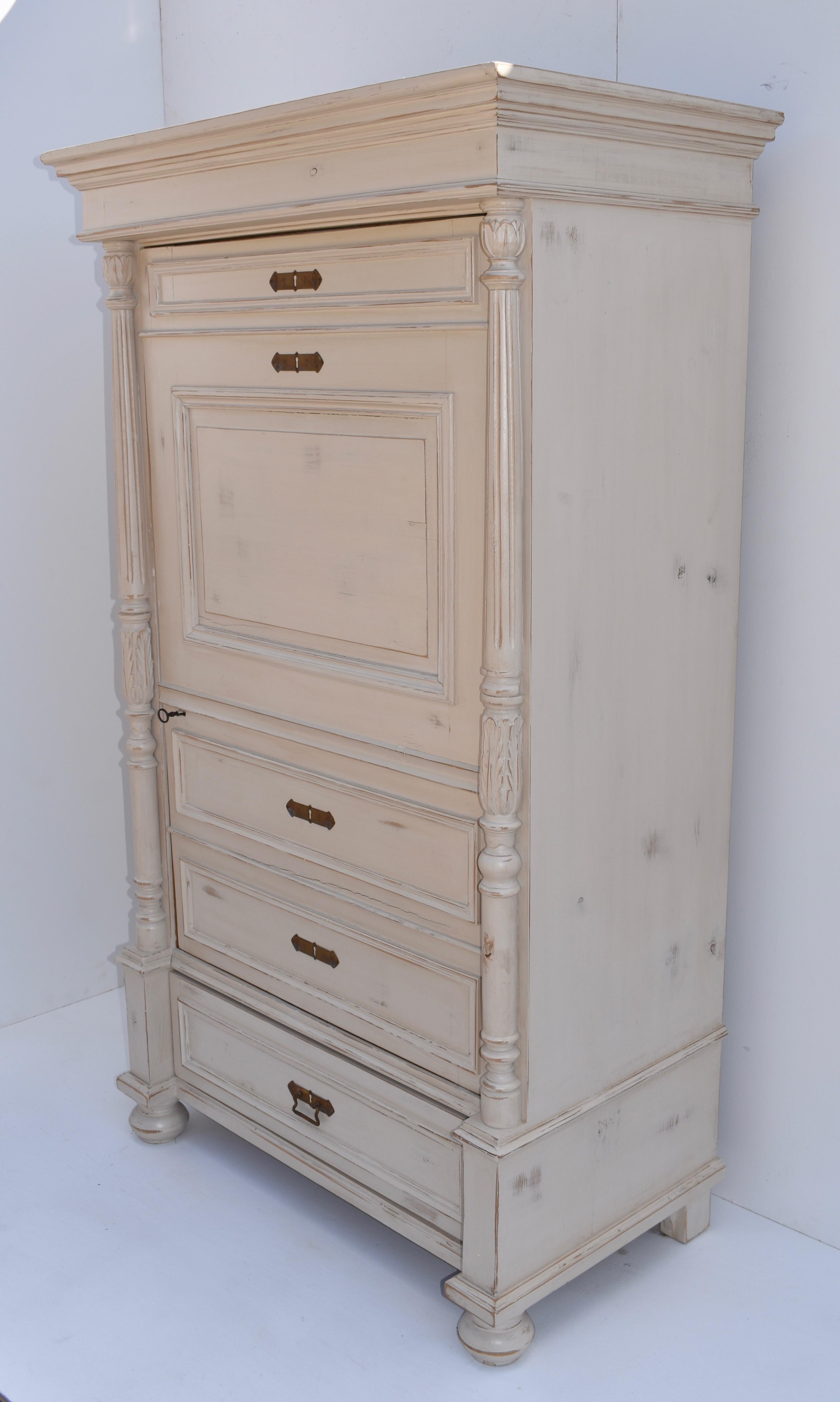 This interesting single door wardrobe presents as a fall-front secretaire, with the panels on the door suggesting a desk top with a drawer above and two beneath. There is a real handcut dovetailed drawer beneath the door and the full fluted columns