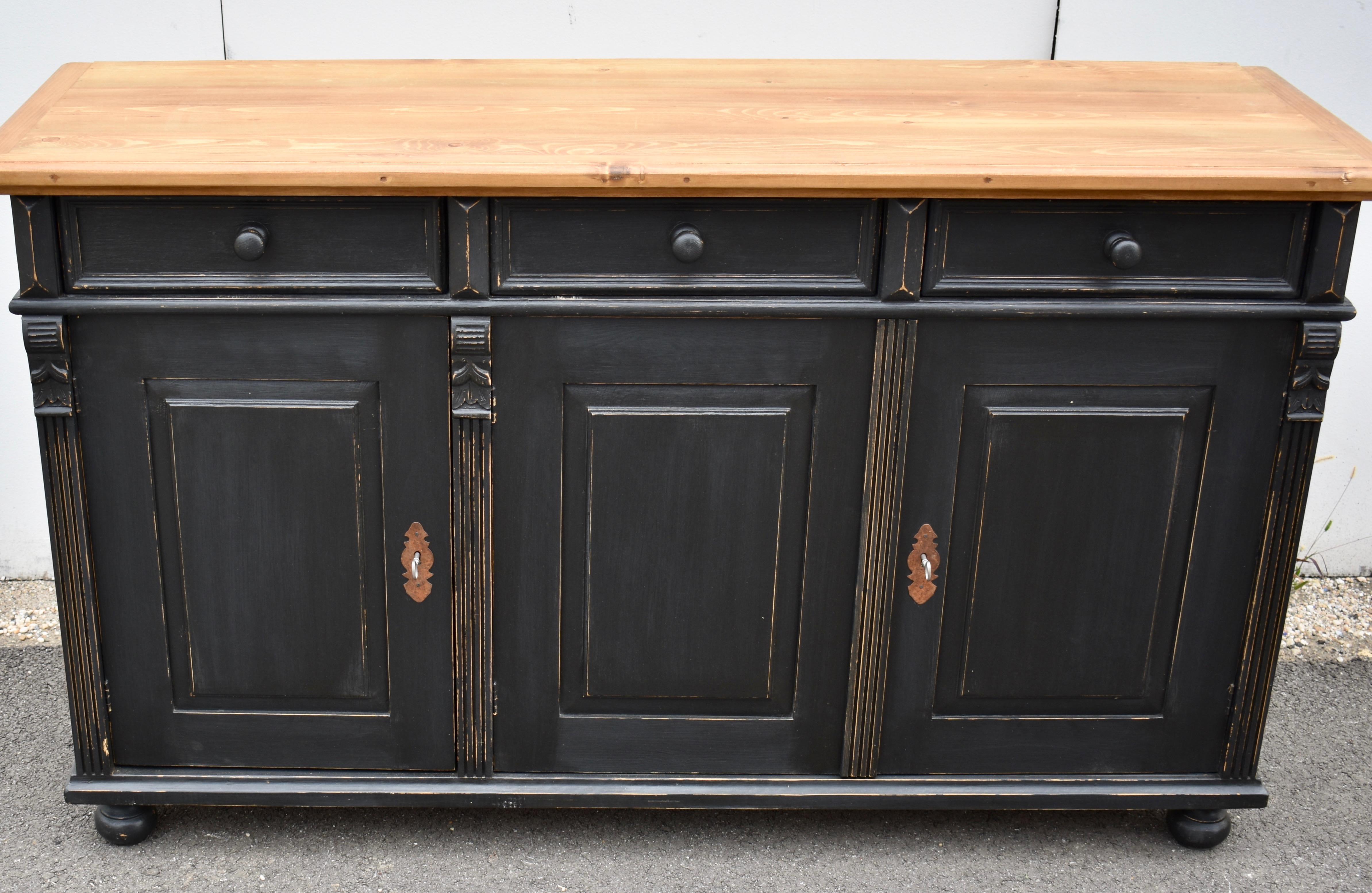 Antique pine sideboards can be hard to find so our workshop in Europe takes good quality European yellow pine to build this piece using traditional design features and construction techniques.  In this case the sideboard base is hand-painted in